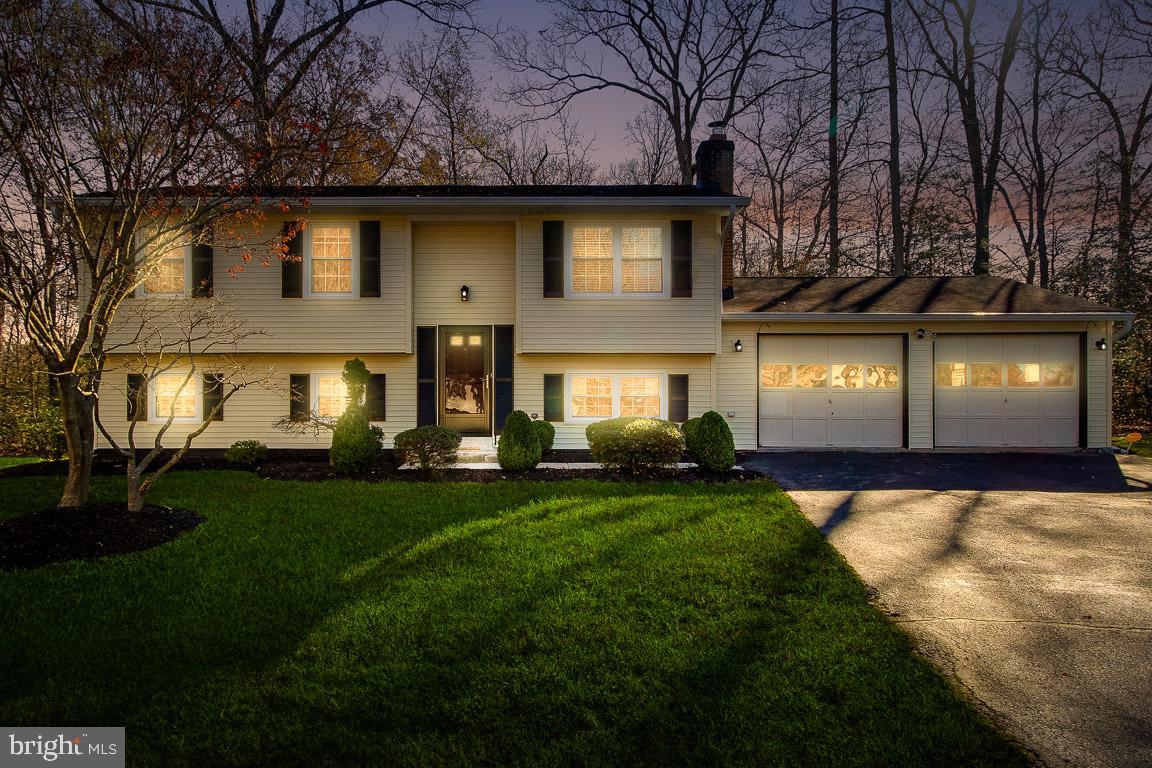 Welcome home to 2217 Holly Oak Court! Located on a quite cul-de-sac, this 4 bedroom home features hardwood floors through out, stainless steel appliances, newer roof and gutters with guards, energy efficient windows, spacious deck off kitchen and huge yard - perfect for entertaining! The upper level opens to a living room, eat-in-kitchen, 3 bedrooms and full bathroom.  Walk down to a large family room with rear entrance and patio, spacious master bedroom with walk-in-closet, full bathroom and laundry/storage area. Located close to AAFB, DC, VA, commuter routes, public transportation, shops, restaurants and entertainment. Be sure to check out the virtual tour as well.  This home won't last long! Don't miss your opportunity to be the proud new owner.
