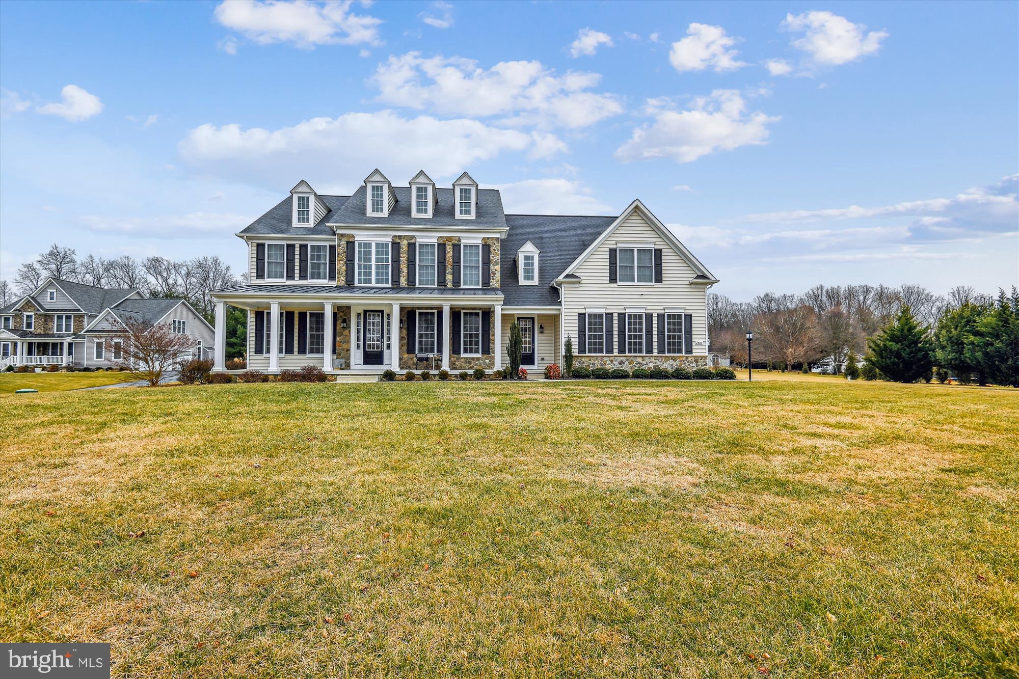 Welcome to this charming traditional home, beautifully crafted with a combination of stone and siding. Offering over 5000 square feet of meticulously designed living space, this home is perfect for both everyday living and grand entertaining.

Upon entering, you're greeted by a stunning foyer with a gracious staircase, setting the tone for the rest of the home. The formal living and dining rooms are ideal for hosting guests, while the entertainer's kitchen, complete with a large center island and pantry, offers everything you need to prepare meals with ease. The spacious breakfast nook, with its bank of windows, overlooks the serene patio and backyard, providing a peaceful place to enjoy casual meals.

The large family room, adjacent to the kitchen, features soaring ceilings and a cozy gas fireplace, creating a welcoming atmosphere. A generously sized home office offers a perfect space for work or study, and an attached three-car garage opens into a large mudroom for added convenience. A powder room and ample closet space round out the main level.

Upstairs, the luxurious primary suite is a true retreat, with a massive walk-in closet and a spa-like ensuite bathroom that includes two separate sinks, a large glass shower, and a soaking tub. Two additional spacious bedrooms share an adjoining bathroom, while the fourth bedroom enjoys the privacy of its own ensuite bathroom. The large laundry room adds to the functionality of this level, while the incredible playroom is the perfect place for toys, games  and stuffies to be enjoyed for hours on end.

The finished lower level is an entertainer's dream, featuring a vast recreation room with natural light streaming in through windows and large walkout doors. An enormous unfinished storage room provides additional space for all your needs.

Throughout the home, you'll appreciate the gorgeous wood floors, recessed lighting, crown moldings, and an abundance of windows that fill every room with natural light. A back staircase leads from the second level directly to the kitchen, providing easy access and added flow.

Step outside and enjoy the lovely front porch, or entertain in the beautiful backyard with its stone patio, perfect for dining al fresco or relaxing in the serene setting. Situated on 1.3 acres of level land, this home offers a gorgeous backdrop for comfortable living.

This home truly has it all – and then some. Come see it for yourself and experience the exceptional beauty and functionality it offers.