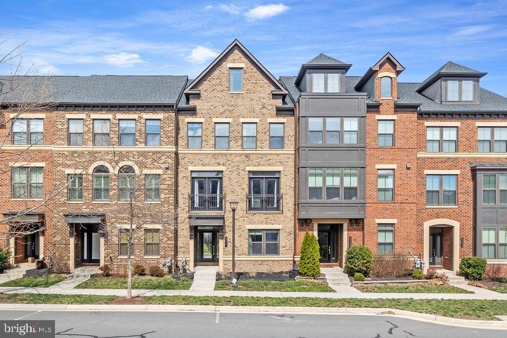 Discover this beautifully updated townhouse offering five spacious bedrooms and four and a half bathrooms spread across four inviting levels. The open layout and added recessed lighting throughout create a bright and welcoming atmosphere, perfect for comfortable living and entertaining.

The heart of the home is the impressive kitchen, featuring an oversized island, sleek stainless steel appliances, and modern fixtures. Hardwood flooring extends throughout the main level and stairs, adding a touch of elegance to the space.

The living room is enhanced by custom-built shelves, providing both style and practicality. Multiple bathrooms boast luxurious heated floors, offering warmth and comfort during colder months.

The top floor features a versatile loft area with a full bedroom and bath, along with access to a rooftop deck—a perfect spot to unwind and enjoy outdoor views. The first level also includes an additional bedroom and full bath, ideal for guests or a home office.

Step outside to two inviting decks, great for relaxation or entertaining. The attached two-car garage adds convenience and ample storage.

Situated in a prime corner unit near Loudoun Station, this home offers easy access to restaurants, shops, and major roads. Don’t miss your chance to own this thoughtfully upgraded and conveniently located townhouse—schedule a showing today!