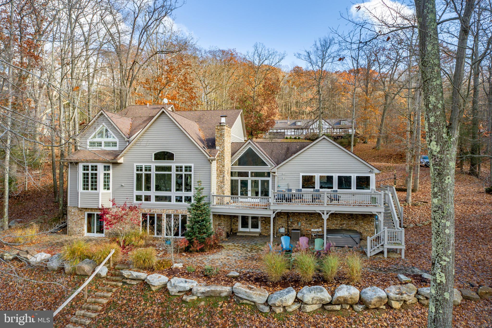 Elegant Modern Contemporary on Lake Shore Drive – This 6Bed 4.5bath home features gorgeous views of Deep Creek Lake, 154’ of pristine lake front, Type A Dock, second kitchenette on the lower level, indoor pool and over 5800 sq ft of luxurious living space! Large ground level Primary Suite. Cathedral ceilings in the main living area envelope the massive stone fireplace, accompanied by timber accents and tongue & groove overhead. Plenty of glass throughout to let the light in. Sprawling eat-in kitchen equipped with stunning granite tops and stainless appliances, adjoining the beautiful formal dining area overlooking the Lake. Lots of additional recreation rooms and outdoor living space. An established rental, "Lake Shore Legacy" generated $176k of gross rental income in 2022 (with 67 nights of owner use) Projected to earn closer to $200k/yr as full time rental. Located on the sought after Lake Shore Drive, you’ll be right in the heart of the area’s 4 Season amenities. Minutes from state parks, local restaurants and Wisp Resort – this property makes for a perfect vacation rental or personal mountain retreat - Call today for your private showing!