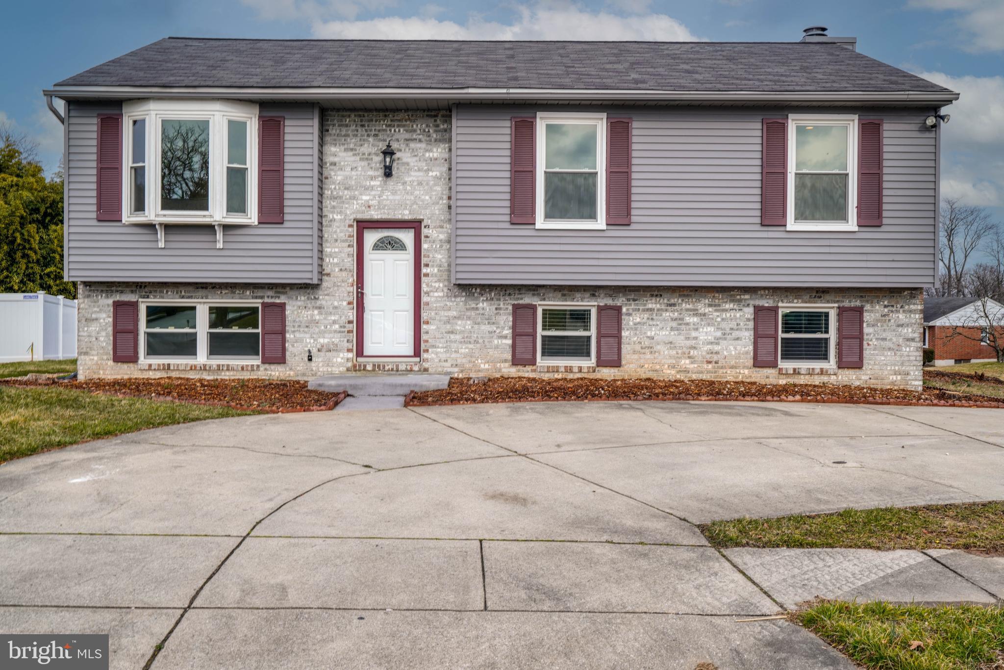 *** The seller is in receipt of multiple offers and requests all offers to be submitted by Sunday night (3/3/24) for review on Monday ***   Welcome to this delightful home! Many recent updates have refreshed it to be ready for its next chapter! Positioned on a corner lot within a peaceful cul-de-sac in a sidewalk lined neighborhood, you can enjoy serenity while still being just moments away from a plethora of amenities for supreme convenience. The classic split foyer layout offers versatile living spaces. The upper level shines with the warmth of refinished hardwood floors and is  flooded with natural light from both the bay window and newer slider door. Vaulted ceilings add to the airy spaciousness of the main living space.  The kitchen is a standout, featuring new appliances, tile backsplash, cabinetry, hardware, and light fixtures, all harmonizing beautifully with the granite countertops and craft tile flooring, accented by the arched breakfast bar opening. Enjoy meals and relaxation al fresco on the large deck overlooking the yard.  The main level hosts two generously sized bedrooms, with the primary bedroom providing direct access to the hall bathroom as well as an unexpectedly large walk in closet. The hall bathroom has also been updated with a new vanity and fixtures. That is just half the home! The lower level provides another huge living space with a built in entertainment center that will hold today's large TVs. Enjoy the plush feel of new carpet when relaxing here. Another bedroom and large updated full bathroom including all new shower tile work and vanity make this level perfect for many uses and household arrangements.  Outside, the level yard invites outdoor enjoyment, with ample off-street parking available in the large driveway and parking pad.   Don't miss out on this exceptional home in an enviable location. Come take a tour and make your offer before another lucky buyer calls this home.