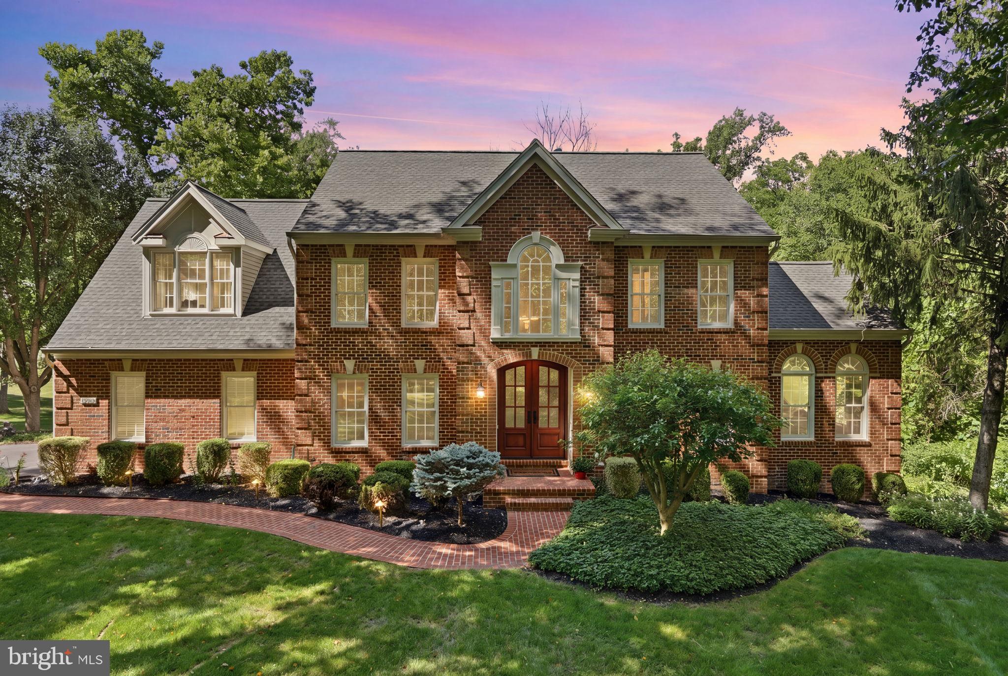 Welcome to one of Shelter Lakes' most exceptional offerings — a magnificent estate home set on 8 beautifully landscaped and wooded acres within this exclusive 52-home community, this 4-bedroom, 4.5-bath residence is a masterclass in refined living.
From the moment you approach the custom arched front doors, it's clear that every detail here was intentional with thoughtful renovations at every turn.
At the heart of the home is a chef's kitchen unlike any other. A double-island layout anchors the space, surrounded by top-of-the-line appliances including a Wolf 6-burner gas range with griddle, Thermador Freedom Series Wi-Fi-enabled column refrigerator and freezer, Miele dual ovens, warming drawer, two dishwashers, and stainless steel range hood. Soft-close cabinetry, dual touchless prep sink faucets, an oversized main sink, built-in retractable power outlets in both islands, wine and beverage refrigerators, and Rubbermaid drawer organizers round out a kitchen designed for those who take cooking seriously.
The multi-season room addition is a true retreat, featuring Brazilian IPé hardwood floors, shiplap accent walls, an elegant stacked-stone gas fireplace with overhead TV, and floor-to-ceiling Easy Breeze windows on three sides. Whether you're enjoying morning coffee or entertaining guests, the views to the deck, pool, and flagstone patios are simply spectacular.
Step outside and discover a resort-worthy backyard. The centerpiece is a 50,000-gallon heated saltwater pool with an 8-person spillover hot tub, two waterfalls, a wade-in area, a diving board, and Wi-Fi smart lighting. A second Jacuzzi-brand hot tub, a 20x20 flagstone firepit, batting/golf cage, and basketball hoop round out an outdoor living experience designed for every age and every season.
Inside, the great room impresses with soaring vaulted ceilings, floor-to-ceiling windows, a stately chandelier, and a stone gas fireplace with a classic mantle. The main level also offers a welcoming arrival room with laundry hookup option, a dedicated home office, a parlor/sitting room with a double-sided fireplace, and a peaceful conservatory — spaces that flex beautifully for modern lifestyles.
Upstairs, a hardwood staircase with wrought iron rails leads to the private living quarters. The primary suite features a spacious walk-in closet and a fully renovated spa bath with heated floors, dual marble vanities, a frameless shower with exterior and interior digital temperature controls, and a freestanding soaking tub. All upper-level full baths have been updated. Dual-zone HVAC provides tailored comfort — one zone for the primary suite, another for the remaining three bedrooms.
The fully finished walk-up lower level offers incredible flexibility, with a bar, a media area with 5.1 surround sound (speakers convey), an unofficial fifth bedroom, a full bath, an exercise room, a kids' play area, and a high-efficiency laundry suite outfitted with two new washers and dryers, a stationary sink, and dedicated refrigerator and freezer. A water softener and treatment room complete the lower level. Additional workspace and storage are tucked beneath the multi-season room with convenient outdoor access.
Peace of mind comes built-in with many recent updates such as the roof, siding, gutters, hvac, hot water heater, garage doors , and newer high-efficiency Carrier dual-fuel HVAC systems keep the home running smoothly year-round.
Shelter Lakes is a quietly prestigious community with a remarkably low HOA of just $720 per year. Horse-friendly lots, sweeping wooded surroundings, and easy access to dining, shopping, and major commuter routes make this location as practical as it is beautiful.
Don’t miss your opportunity to own this gem!