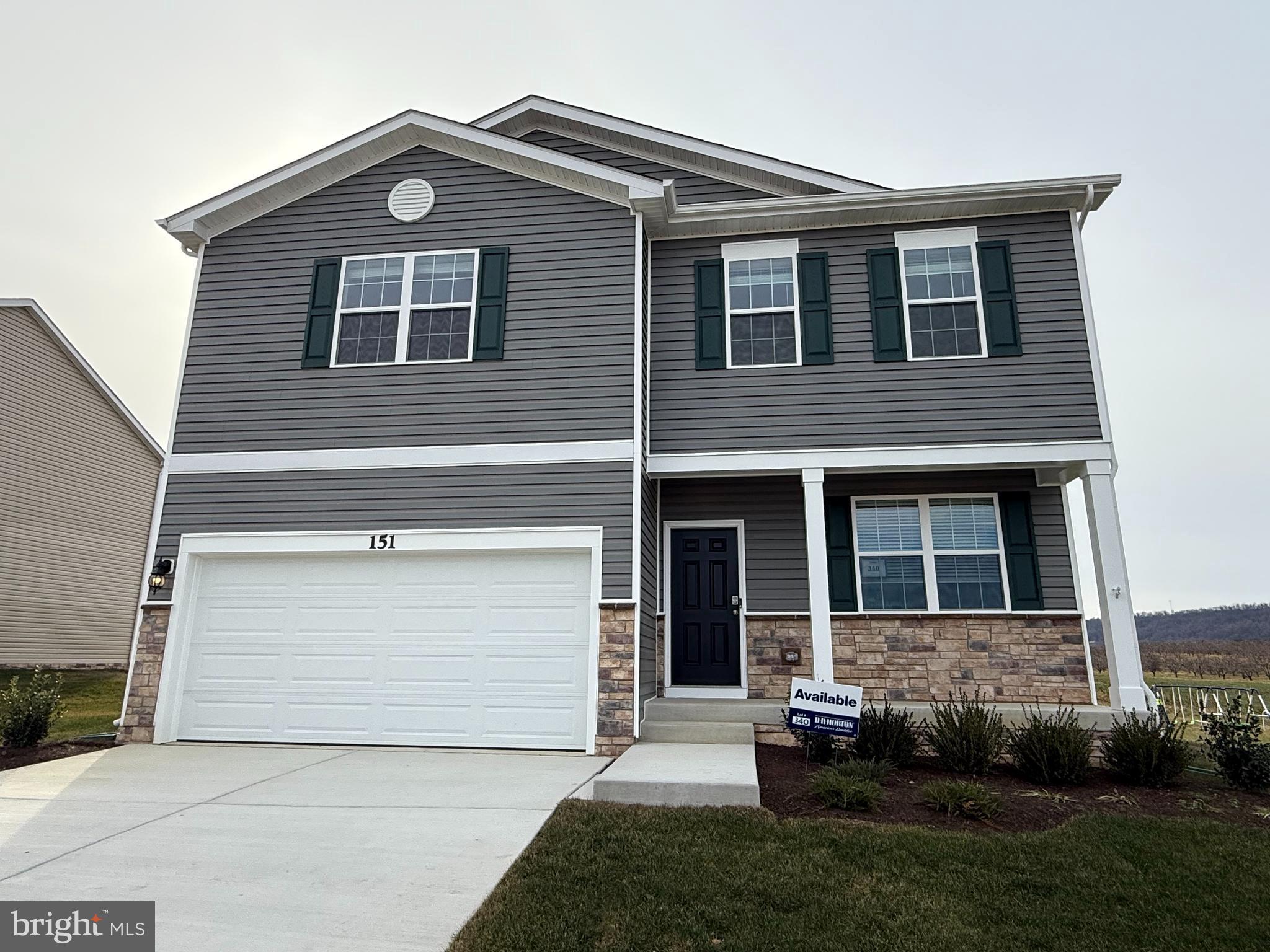 DON'T WAIT TO BUILD.  IMMEDIATE DELIVERY WITH AMAAAAAZING VIEWS.  This 4 bedroom, 2.5 bath comes with  LVP flooring throughout on the main level and a second level laundry and bathrooms. An open foyer and bonus room welcome you as you walk in. House features 9 foot ceilings on the main level. Enjoy lots of natural light from the large windows and sliding glass door as you enter the family room and open concept kitchen which includes white cabinets, stainless steel appliances, granite and large pantry.  This home also basement that includes a finished rec room, a rough in for a 3rd full bath and added storage. This house backs to a large farm so there is nothing built behind it.