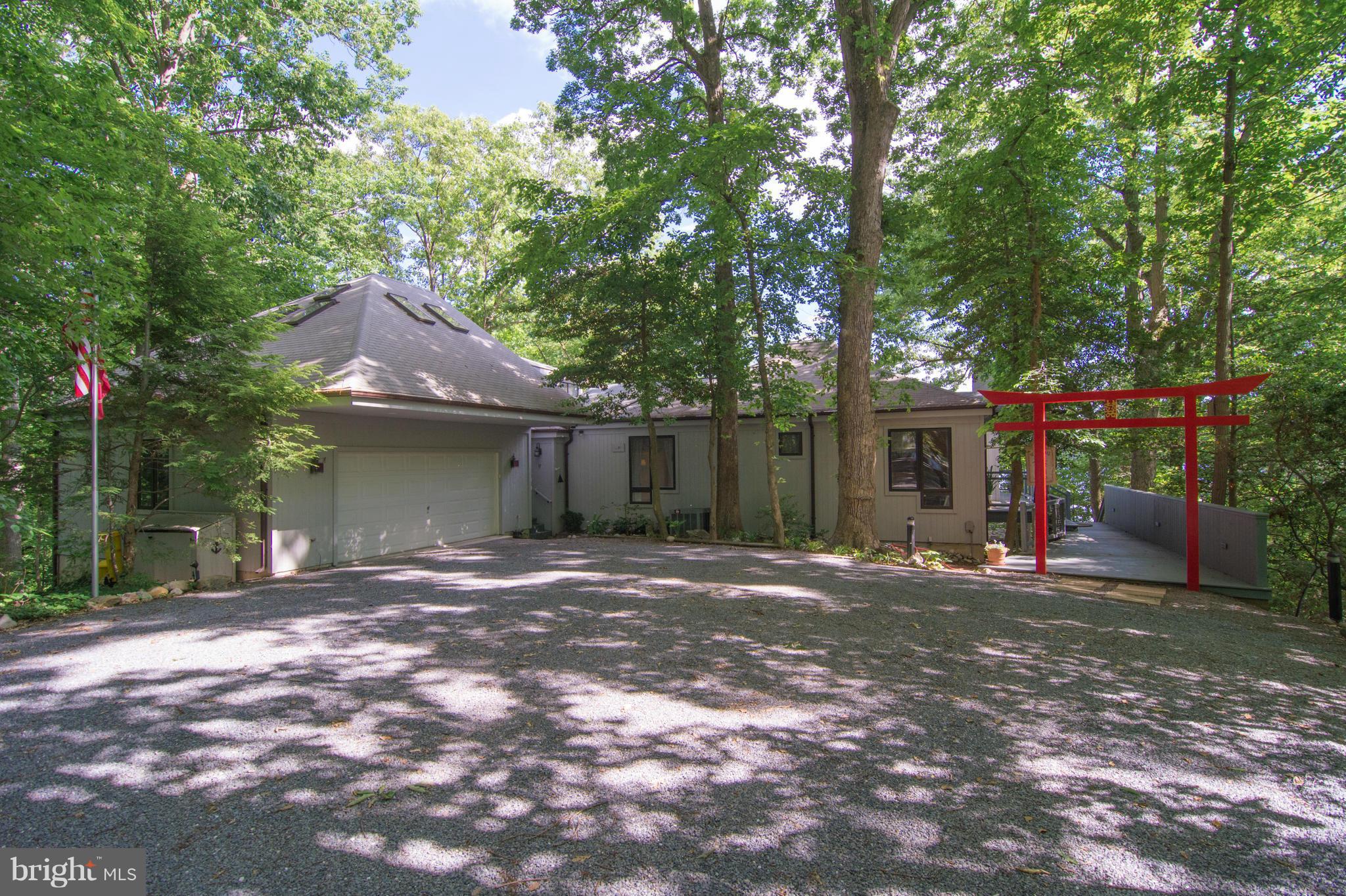 EXCEPTIONAL ONE LEVEL CONTEMPORARY!!! Water front!  6' deep MHT SAIL BOATS, semi private cove, direct access to South River!  Boat lift, 60' pier.  Screened in Gazebo for eating crabs, electric to pier, Copula 360 degree view to relax or use as private work space, artist studio over garage. Lots of privacy and Trees. Way to much fun here! This is a great location, home and neighborhood! CALL NOW!