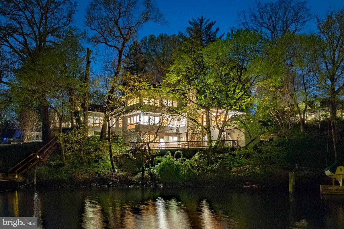$105,000 price reduction for contemporary waterfront home in Eastport. Close proximity to downtown Annapolis. Designed by architect, Scott Rand, this home was custom built for the hillside property and offers lovely views of Wells Cove and Spa Creek. Most rooms have waterviews. Multiple decks for outdoor entertaining. Deep water with dock and boat shed for storage. Quiet dead-end street.