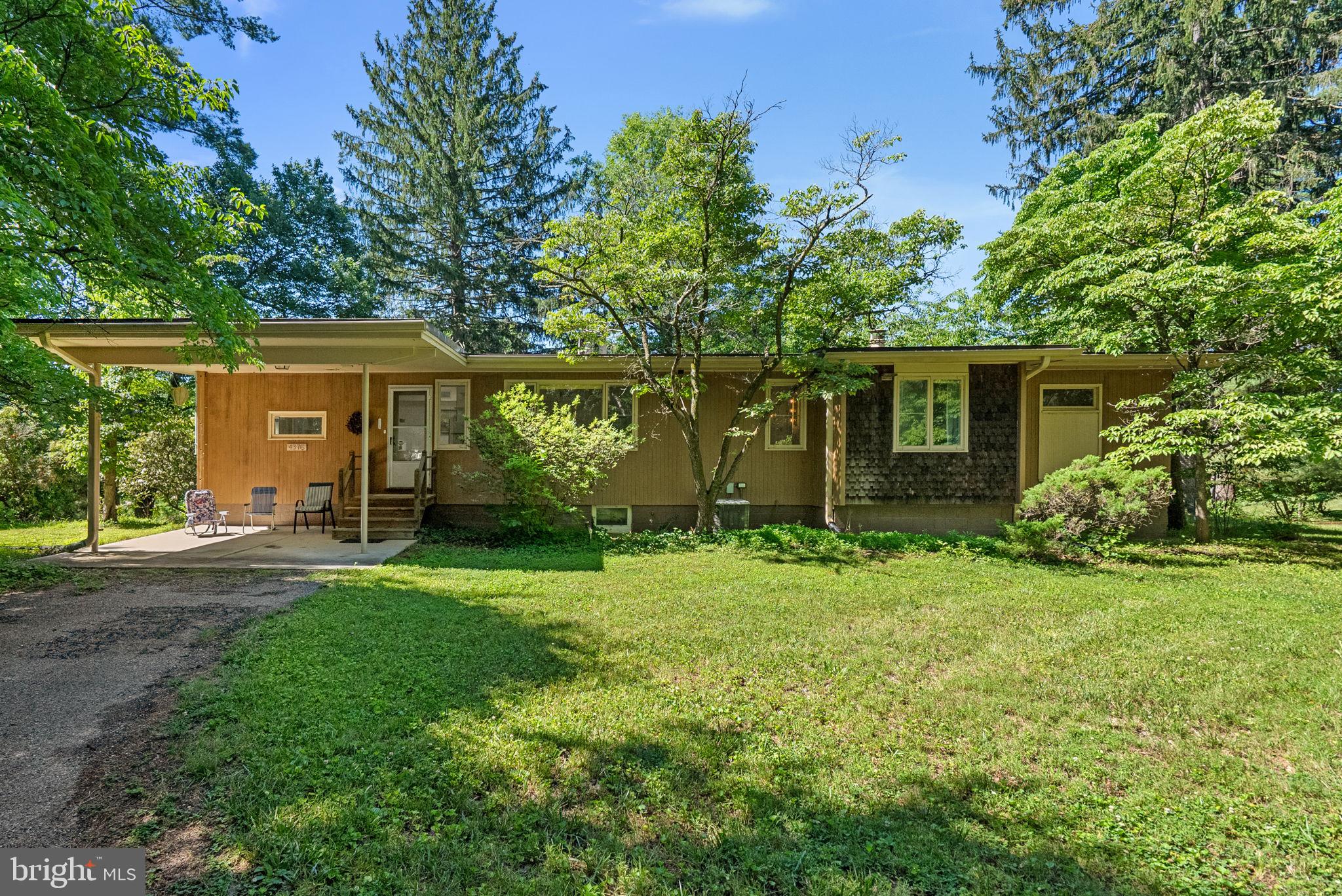 Amazing opportunity to own a charming Contemporary/Mid Century Modern home nestled in sought-after Howard County. This home aims to please with charming original features throughout. The home welcomes you with a sunny living room that leads to the large kitchen. The bright living room welcomes with a wood burning fireplace.  The family room/office/Den includes a unique curved wooden ceiling that adds warmth to the space. Down the bedroom wing, you will find 3 large bedrooms and 2 bathrooms.  The finished basement space offers ample light with floor-to-ceiling windows, as well as a plethora of storage space.   Enjoy fresh air on the 12+ acres leading to Cattail Creek! You'll find a detached workshop/Garage and Barn space. Easy access to shopping, dining and commuter routes.  Don't miss your chance for a Frank Lloyd Wright inspired masterpiece!