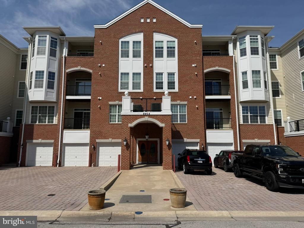 Welcome to this bright and inviting 2 bedroom, 2 bath condo in the  desirable 55+ Cedar Ridge at Piney Orchard community.   Enjoy an open floor plan with a cozy living room fireplace, kitchen with stainless steel appliances, dining room, and peaceful views from the private balcony and bay window.   Elevator access, assigned parking plus a detached garage add everyday convenience.   

Cedar Ridge offers outstanding amenities, including a clubhouse, fitness center, outdoor pool, bocce and tennis courts, plus miles of scenic walking trails. As part of Piney Orchard, residents also enjoy additional pools, nature preserves, and recreational facilities.

Located close to shopping, restaurants, grocery stores, and major commuter routes, this home combines comfort, convenience, and an active lifestyle—making it a wonderful place to call home.

Updates include  recently replaced carpet in living rooms and bedrooms,  stainless steel French door refrigerator and 2 new windows in each bedroom.