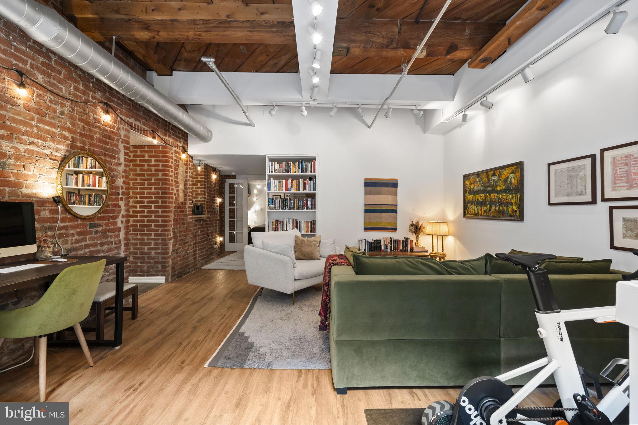 Welcome to 301 Race Street, Unit C002, a charming junior one-bedroom residence located in the iconic Wireworks Condominiums in the heart of Old City, Philadelphia. This home blends authentic architectural character with comfortable city living.

From the moment you enter, you're welcomed by soaring ceilings, exposed brick, and wood beams that create a warm and inviting atmosphere. Large windows overlook the beautiful courtyard, filling the home with natural light and offering a peaceful retreat in the middle of the city.

This thoughtfully designed junior one-bedroom layout accommodates a queen-sized bed while maintaining an open and airy feel throughout the living space. The home also offers two convenient access points, a courtyard entrance as well as entry through the building’s secured lobby.

The newly remodeled kitchen features a clean, modern design with updated finishes, making it both stylish and practical for everyday living. A cozy nook provides the perfect spot for morning coffee, dining, or a home office setup.

Recently installed designer flooring and new windows add to the home’s fresh, updated and well-maintained feel.

Residents of the Wireworks Condominiums enjoy a beautiful central courtyard, secure entry access, elevator service, bike storage, private storage lockers, and a professionally managed association, all within a pet-friendly community that celebrates the building’s historic charm.

Location is where this home truly shines. Situated in the heart of Old City, you're surrounded by cobblestone streets, historic landmarks, acclaimed restaurants, cafés, and art galleries. And nothing captures the neighborhood’s energy quite like First Fridays, when the streets come alive with art, music, and community. You'll also enjoy close proximity to Independence National Historical Park, the Delaware River waterfront, and easy access to public transportation, major highways, and Center City.

This lovely unit offers a rare opportunity to own a character-filled home in one of Philadelphia’s most historic and vibrant neighborhoods, where history, culture, and city living come together just outside your door.