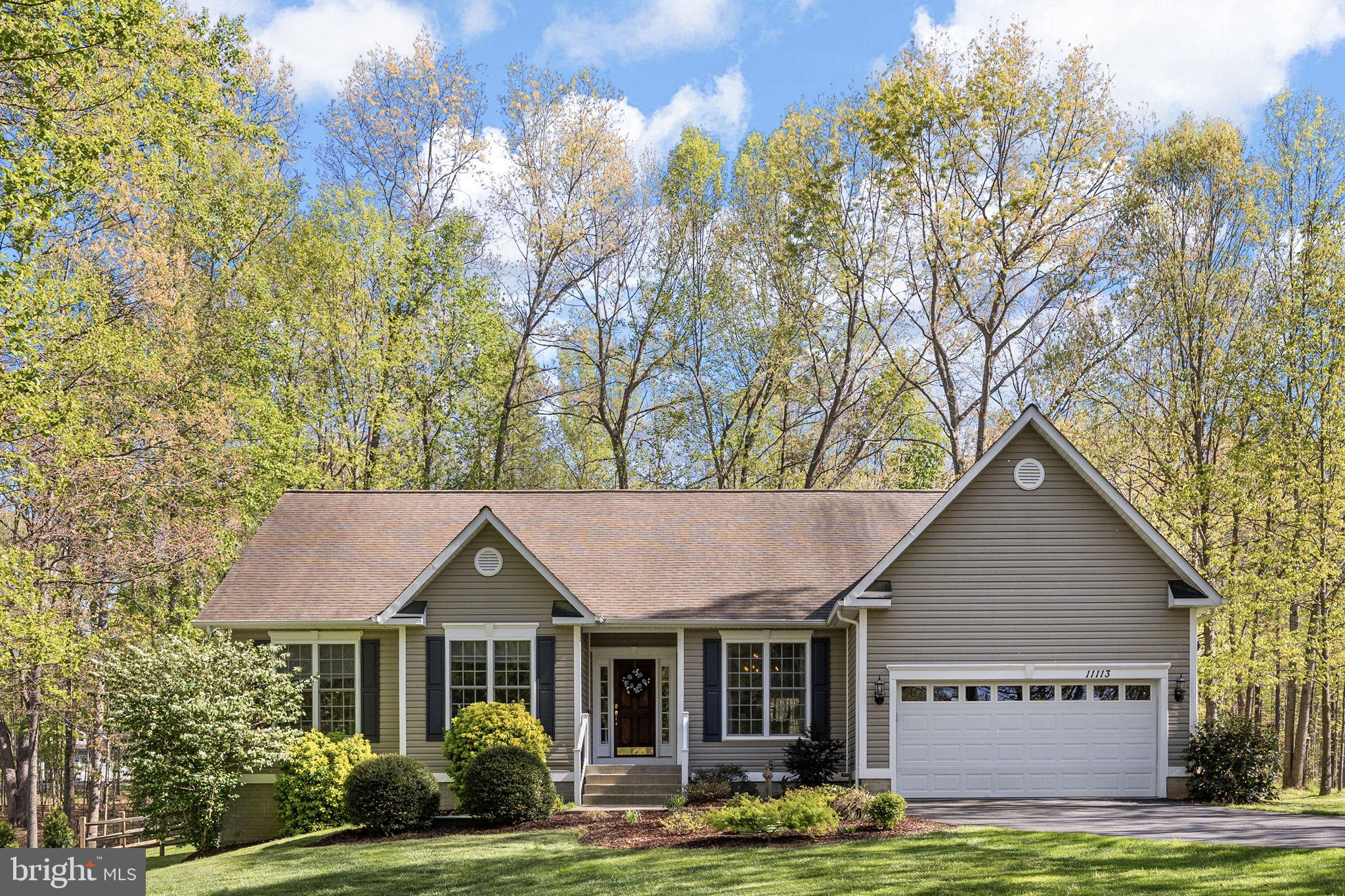 Discover the lake lifestyle at this stunning water-access home on Lake Anna—where relaxation meets adventure! Situated on the public side of the lake, this beautifully maintained property rests on a manicured 1-acre lot with lush landscaping and a fenced backyard, perfect for kids and pets to roam freely. Located on Lake Anna’s sought-after southern end—known for its cleaner, deeper waters—this home is tucked inside the gated Rockland Creek subdivision, a golf cart-friendly community offering high-speed Xfinity Comcast internet. A rare highlight is your assigned boat slip (#71) at the community marina, featuring brand-new docks (completion expected by July)—a true rarity at Lake Anna and a major value add. Inside, you’ll find 2,115 finished square feet of thoughtfully designed living space, including 3 bedrooms, 2 full baths, and a dedicated home office with French doors. Hardwood flooring, vaulted and 9-foot ceilings, crown molding, arched doorways, and a cozy gas fireplace elevate the home’s style and comfort. The kitchen is a showstopper, featuring sleek Brazilian marble countertops, a stunning 5-burner Italian gas stove with electric oven, stainless steel appliances, Jenn-Air refrigerator, and a tile backsplash. It opens seamlessly to the breakfast area with direct access to the rear deck—perfect for indoor-outdoor living. A separate formal dining room adds elegance for entertaining. The one-level ranch layout offers a desirable split-bedroom design. The spacious primary suite includes a tray ceiling, new hardwood flooring, a walk-in closet, and en-suite bath with a soaking tub, double vanity, tiled shower with bench, and new glass door. On the opposite side of the home, guests will enjoy two additional bedrooms and a full bath. A laundry room with tile flooring, utility sink, and included washer and dryer completes the interior. Step outside to the low-maintenance composite deck with sleek black railings and a dedicated gas line for your grill. Hop in your golf cart for a quick ride to the private waterfront common area to launch your boat, cruise, water ski, fish, or simply take in the beauty of Lake Anna. Additional features include a 2-car attached garage, paved driveway, storage shed, and a walk-in crawl space that provides additional storage. Rockland Creek offers a prime location just minutes from local favorites like Lake Anna Taphouse and Lake Anna Winery, as well as marinas, dining, and grocery stores—ensuring convenience and fun are always close by. Recent updates include: well pump (2024),  water pump (2023), and hot water heater (February 2026). Whether you're searching for a weekend escape or your forever home, this exceptional Lake Anna property delivers. Come see it for yourself—you’ll fall in love! Short term rentals are permitted.