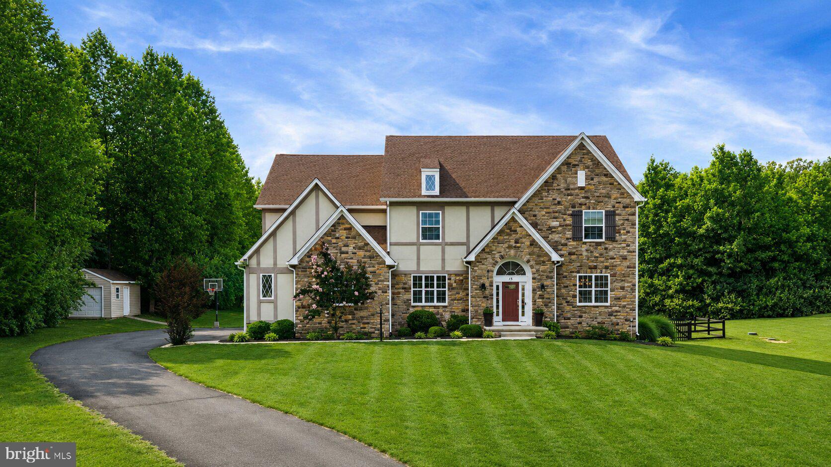 Welcome to 15 Boxwood Ct, where over 6,000 square feet of living space, private acreage, and resort-style outdoor living come together in Stafford’s sought-after Poplar Estates community. Set on more than 3 acres on a quiet cul-de-sac, this exceptional property offers the space, privacy, and flexibility buyers are looking for, all while keeping everyday conveniences, commuter routes, shopping, and dining within easy reach. Inside, a two-story foyer creates a beautiful first impression and opens to thoughtfully designed living spaces with hardwood floors, detailed trim work, and a layout that works just as well for everyday living as it does for entertaining. Formal living and dining rooms provide elegant gathering spaces, while the kitchen serves as the heart of the home with granite countertops, rich cabinetry, stainless steel appliances, double wall ovens, a large center island, butler’s pantry, walk-in pantry, table space, and an upgraded six-burner propane cooktop. The adjoining family room is anchored by a dramatic floor-to-ceiling stone fireplace and offers a warm, inviting place to gather at the end of the day.

The main level includes a bedroom and full bath, creating valuable flexibility for guests, extended stays, multigenerational living, or a private office. Upstairs, the spacious primary suite offers a relaxing retreat with a lighted tray ceiling, walk-in closet, and a well-appointed bath featuring a dual granite topped vanity and oversized tiled shower. Additional bedrooms are generously sized and thoughtfully arranged with both Jack-and-Jill and private en-suite bath access, giving everyone comfortable space of their own. The finished walk-up lower level adds even more versatility with a spacious recreation area, dedicated fitness space, an additional bedroom with a large walk in closet, full bath, and abundant unfinished storage.

Outside is where this property truly shines. Designed for relaxing, entertaining, and making the most of its private setting, the backyard feels like your own retreat. A screened composite deck and paver patio create multiple places to gather, dine, and unwind, while a hot tub and  heated saltwater pool with decorative water features is ready for summer days at home. Wrought-iron fencing defines the pool area and dog run, and the expansive 3+ acre homesite offers room to play, garden, explore, and enjoy the privacy that makes Poplar Estates so special. With a side-entry 3-car garage, upper-level laundry and the upstairs HVAC system replaced in 2025, 15 Boxwood Ct offers the rare combination of space, comfort, outdoor living, and convenience in one remarkable Stafford property. Some photos have been virtually staged to help illustrate the potential use and layout of the spaces