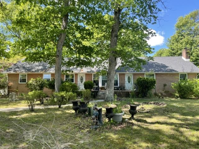 INVESTOR ALERT! Quiet country living, just outside of the City of Dover limits. This spacious brick ranch home, situated on nearly 3/4 acres and surrounded by large shade trees, has a finished basement and oversized two-car garage. The home is in need of some cosmetic "TLC" but offers so much potential! This home has 5 bedrooms and 3.5 baths. Two additional rooms in the finished basement have been used as bedrooms in previous years. The large eat in kitchen is perfect for entertaining, w/ white cabinetry, laminate flooring, pantry with all appliances remaining. Just off of the kitchen you'll notice a roomy dining area and family room with access to the rear of the home. The generously sized living room w/ ceiling fan has a lovely, seated bay window providing plenty of natural light. Making your way through the first floor of the home, you'll find two nicely sized bedrooms w/ ceiling fans and a full hall bath w/ soaker tub. The main bedroom w/ huge walk-in closet and ceiling fan offers a spacious full bath w/soaker tub and tiled surround, separate seated shower w/ glass doors and linen closet. The primary bedroom has private access to the laundry area, sunporch and dining/family room areas. Upstairs is the 4th bedroom w/ half bath and a large attic for all your storage needs. Making your way to the lower level of the home you'll find the expansive finished basement w/ LVP flooring and a 5th bedroom w/ egress window. There is also a stone fireplace, but it has been closed off. It MAY be able to be reopened but the seller is not certain. In 2002 the home had a new roof installed, new windows, HVAC, exterior doors and gutters. The entire side and backyard have been enclosed with a white vinyl privacy fence. This area is massive offering tons of space. Bring your boat, trailer maybe your RV even, plenty of parking! The home is being sold strictly AS IS. Seller will make no repairs. The home is in need of a new septic so no FHA, USDA or VA buyers please. Inspections will be for informational purposes only. Buyer is responsible for all due diligence, repairs and certifications. This home has so much to offer! With some "TLC" this diamond could sparkle once again!