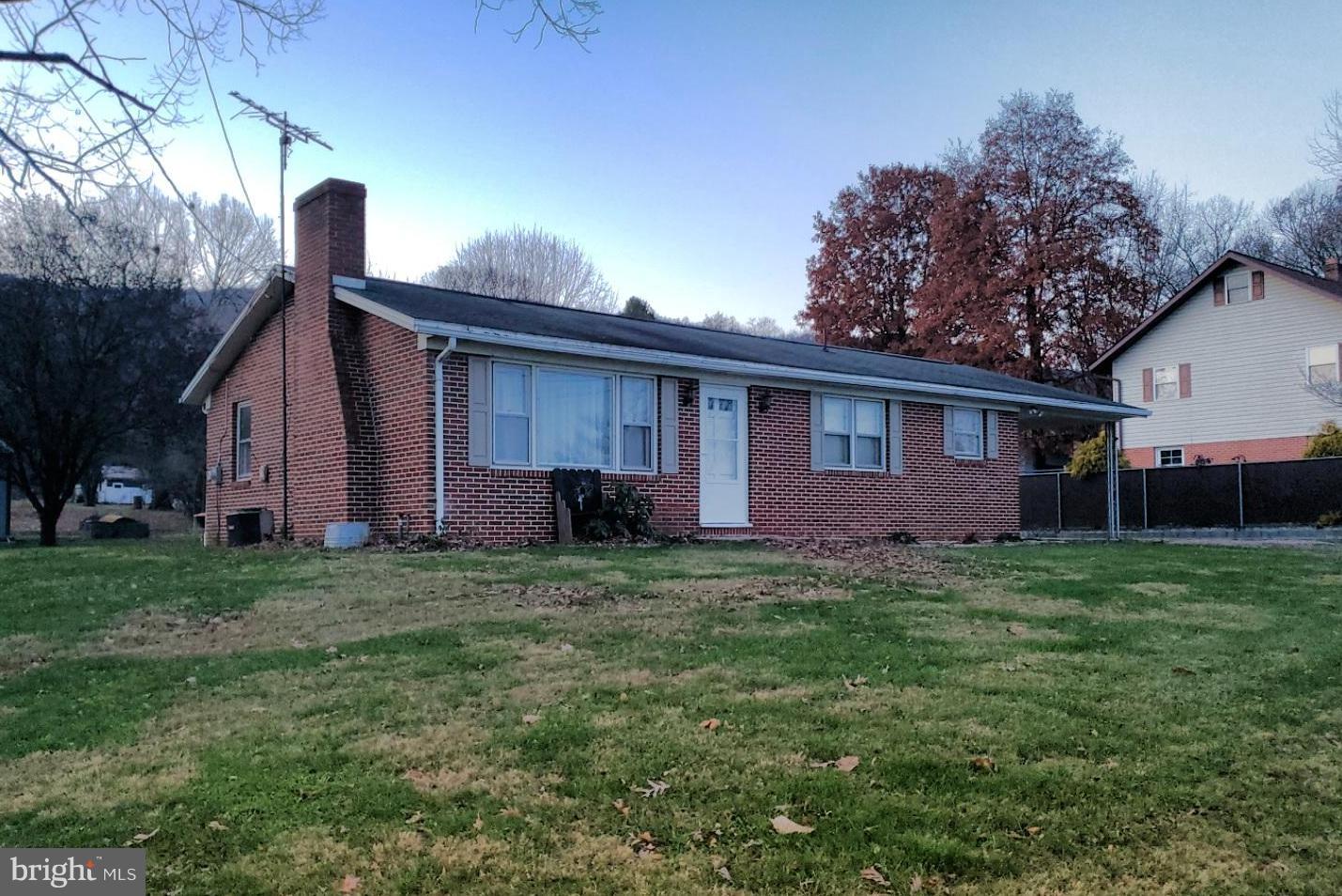 MOVE RIGHT IN!  This remodeled three bedroom all brick rancher is ready to go. Refinished hardwood floors, updated kitchen and bath. country setting yet close to town, wood burning fireplace, central air, large back yard with shed and a full walkout basement. All appliances convey!