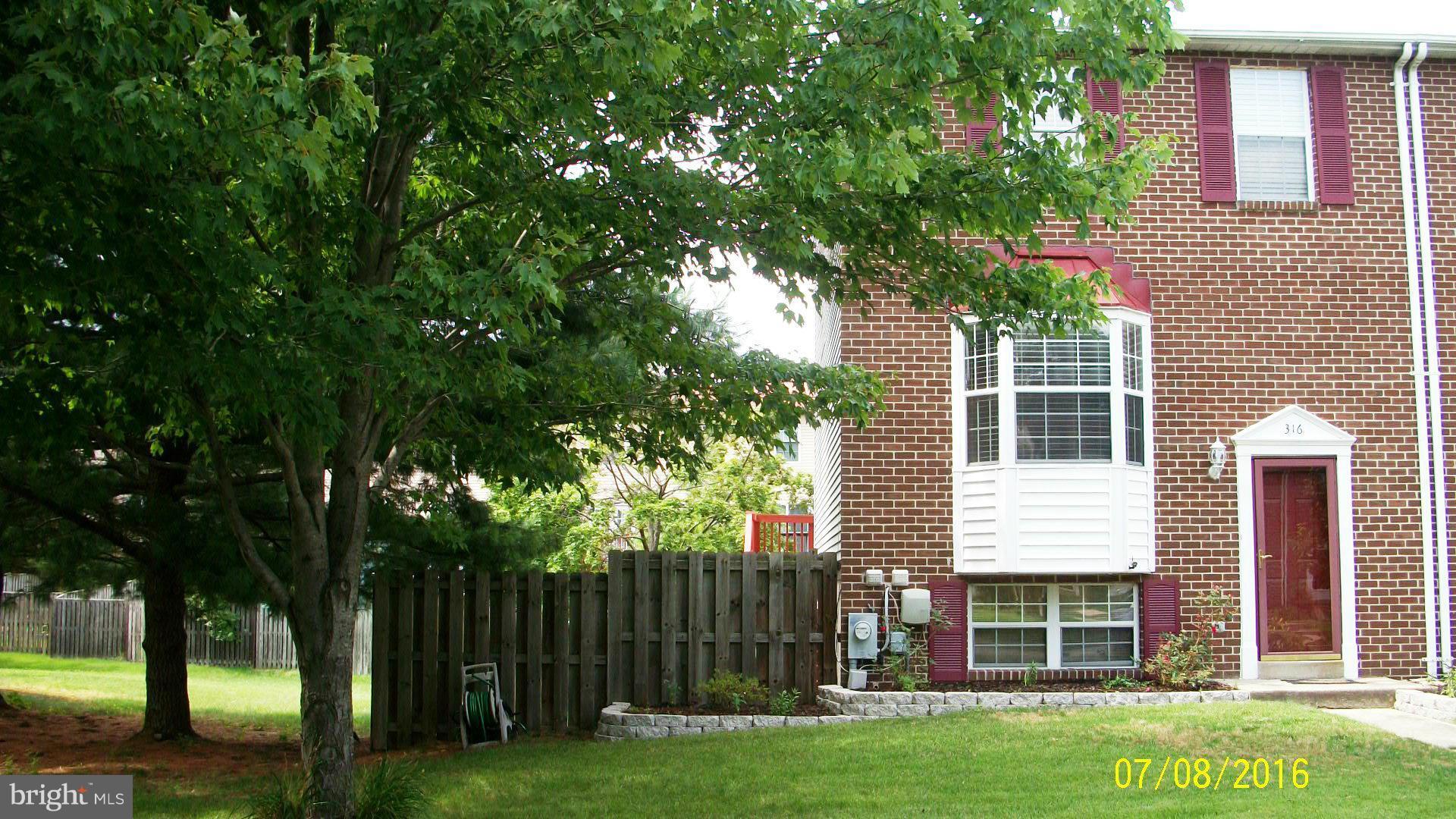 Gorgeous end unit townhouse in Aspen Park.  Fenced in back and side yard!  All new wood floors, paint, lighting, trim & carpet.  Split Foyer style home with large breakfast bar overlooking spacious dining area.  Newly stained deck with stairs to back yard. Finished lower level with walkout to covered patio area. Lots of storage space. Easy commute to Baltimore, Annapolis & Fort Meade
