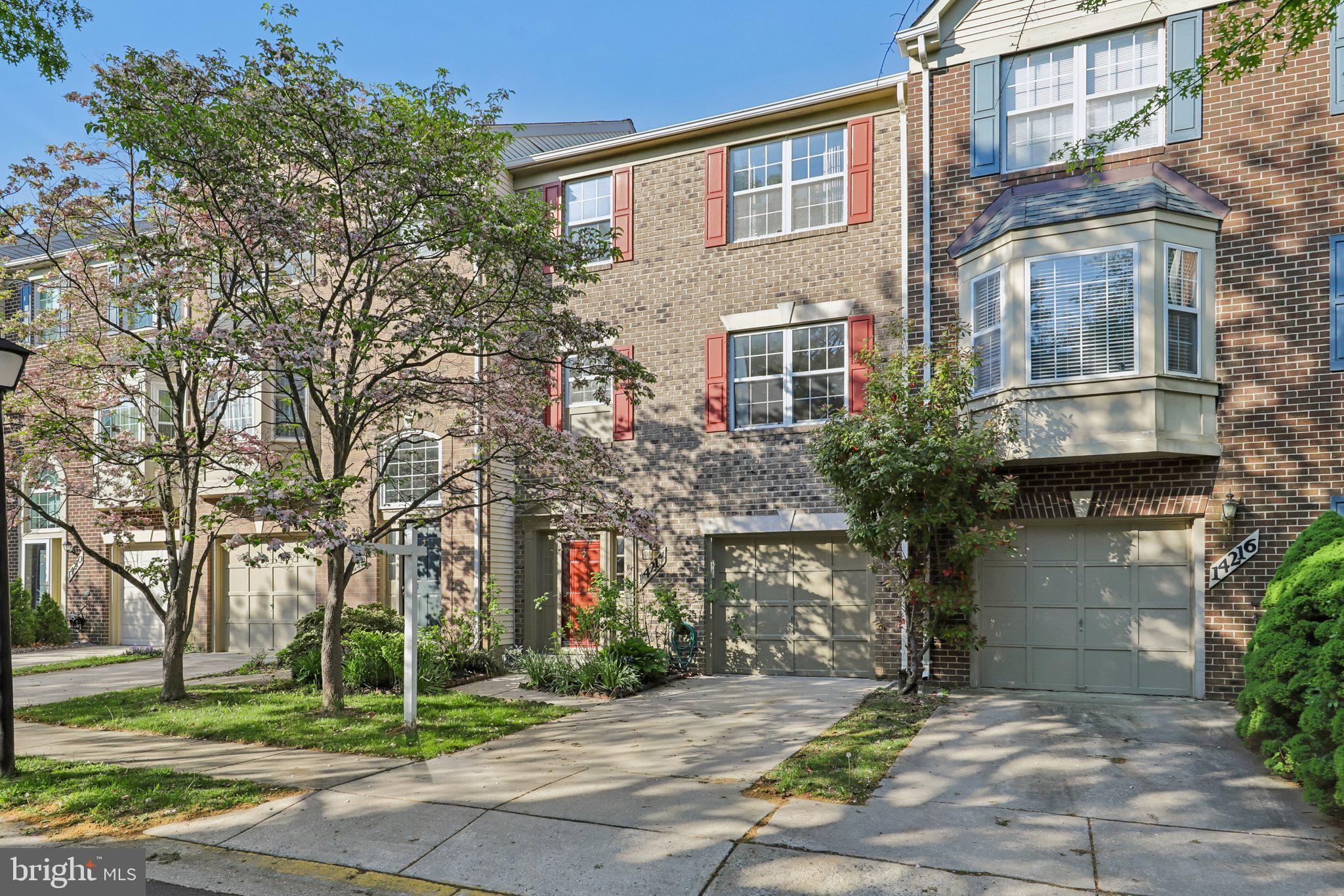 Gorgeous brick front, garage townhome in sought after Parker Farm a quiet and tight knit community. This well maintained home offers gleaming hardwood floors in the living & dining rooms.  The renovated kitchen features an open layout, soft-close cabinets, granite counters, pendant lights, stainless steel appliances, and a ceramic tile floor.  The breakfast area has sliding glass doors leading to a large back deck. The incredible primary suite features a vaulted wood ceiling, a walk-in closet, upgraded lighting, a private bath with dual vanities, a soaking tub, and a walk-in shower.  Downstairs is a walk-out lower level with french style glass doors to the recreation room/library, laundry room and half bath. Additional features include stunning vaulted hardwood ceilings, large closets, crown moldings, and a gas fireplace.  The fenced yard has a lovely patio and a raised bed.  Over $35k of improvements over the last 2 years: new roof, new furnace and AC, new water heater, and whole house freshly painted.