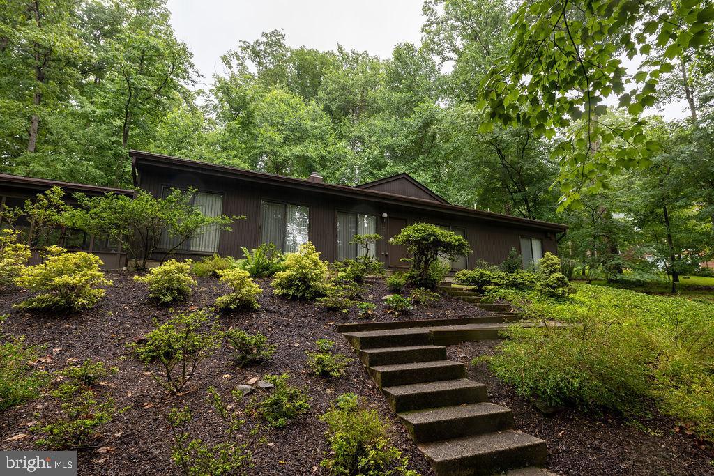A Private Woods Oasis Awaits! Sought after Caves Valley Community!

Nestled at the back of a private, wooded cul-de-sac in the highly sought-after Caves Valley area, this beautifully maintained 4-bedroom, 2 full and 2 half baths rancher is a rare opportunity to own a true oasis. With stunning views of nature from nearly every window,/sliding doors, the home effortlessly blends comfort, space, and tranquil natural beauty.

The Perfect Indoor-Outdoor Lifestyle

Relax after a long day in the screened-in porch and immerse yourself in the peace of the surrounding woods. This unique space is ideal for enjoying meals and quiet moments, entirely bug-free. Step inside to discover a generously sized kitchen, perfectly equipped for meal preparation and holiday cooking, complete with double wall ovens. The home offers spacious living and dining areas that flow together beautifully, creating the perfect private retreat for entertaining family and friends.

Owner's Suite and Versatile Spaces

Unwind in the expansive owner’s suite, featuring a sitting area, an oversized walk-in closet, and a large en-suite bath for a serene personal sanctuary. Throughout the home, generous living spaces provide ample room for everyday living. The full basement awaits your personal touch, offering endless possibilities for a home gym, recreation area, or whatever you desire.

Partially Finished Basement

The partially finished basement offers the perfect blend of additional living space and functionality. The finished portion features a versatile bonus room and a convenient half bath, ideal for a home office or recreation room, workout space, or guest area. The unfinished rear section provides abundant storage space and offers endless possibilities for future expansion, hobbies or workshop use.

Tranquility and Convenience

Enjoy the unparalleled tranquility of this rare, ranch-style home in one of Owings Mills’ most desirable settings. This peaceful oasis remains conveniently located near premier shopping, dining, golf courses, and major commuter routes. Don’t miss your chance to experience this unique lifestyle.

UPDATES: (per owner)
Trane Oil Furnace Model#TTHV1C072A948SA Installed 9/2024
Trane SEER2 Air Conditioner, New Coil, etc. 9/2024
Washing Machine - Speed Queen ModelTR5003WN replaced 12/2024
Water Holding Tank - replace 6/2020
Roof Replaced 10/2018 - Transferable warranty
Gutters Replaced 10/2020
Replaced Carport Concrete - April 2015
Addition of Owners  room bathroom & Owners Room Sitting Area & Screened-in porch - 1997
Kitchen Updated - 10/1995
Sink, Granite countertops & stove - 10/2013
Double Wall Ovens replaced 6/2015
Replaced dishwasher, Model KDTM354ESS - 10/2019
French drainage system around the foundation and a system towards the back woods to direct water away from the house.