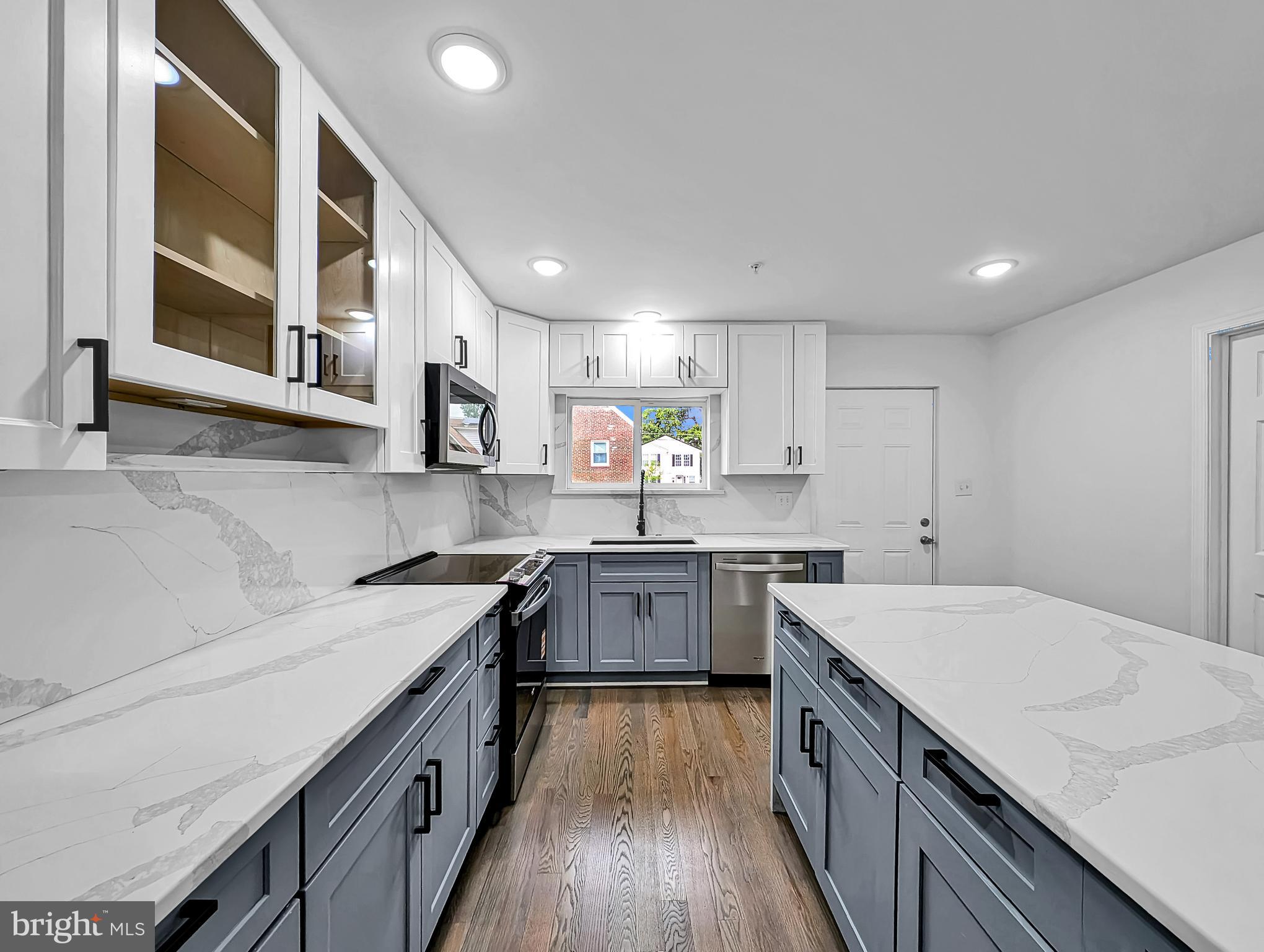Completely remodeled and thoughtfully updated, this expansive home offers bright, light-filled interiors and an open, functional layout throughout. The main level features a spacious open-concept kitchen, dining, and living area designed for comfortable everyday living and entertaining, along with 2 bedrooms and 2.5 bathrooms.

The upper level includes 4 additional bedrooms and 2 full bathrooms, highlighted by an oversized primary suite with a luxurious spa-like bath and generous space throughout.

The fully finished walkout basement offers abundant additional living space, complete with daylight windows, a kitchenette, and a full bathroom — ideal for guests, extended living, or recreation.

Outside, the property features a long driveway, providing ample parking and convenience.