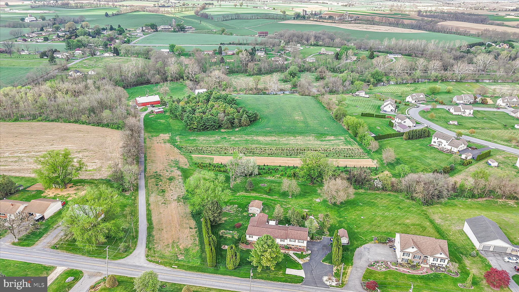 Public Auction Saturday, June 13, 2026 @ 12 noon - Open House Saturdays May 23 & 30 from 1-3 pm - Buyer required a 10% non refundable deposit, settlement within 60 days - Buyer pays the 2% RE transfer tax - List price does not reflect the final sales price * Valuable 15.36 acre farmette in the Womelsdorf/Stouchsburg Area with the Tulpehocken Creek running through it. Featuring an 18th century limestone two story farmhouse, deep windowsills. Main floor has an updated kitchen, dining area, living room and laundry. Upper level has 3 bedrooms (one with a privacy violation), office and 2 full baths. New and bright 18x22 addition with a bedroom, full bath and walk in closet. A total of 2,616 SF living area. Newer 42x72 bank barn with a robust structure allowing for heavy equipment. Includes an office and powder room. The lower level has three 10'H overhead doors. Two garden sheds. Enough cannot be said regarding the setting of this property with a blend of history and beauty! A long macadam driveway boasts privacy and quietness. Sit on the covered porch and enjoy the beautiful view of the Tulpehocken Creek. Approximately 8 acres of tillable land currently in hay and tree production with established Christmas tree business.