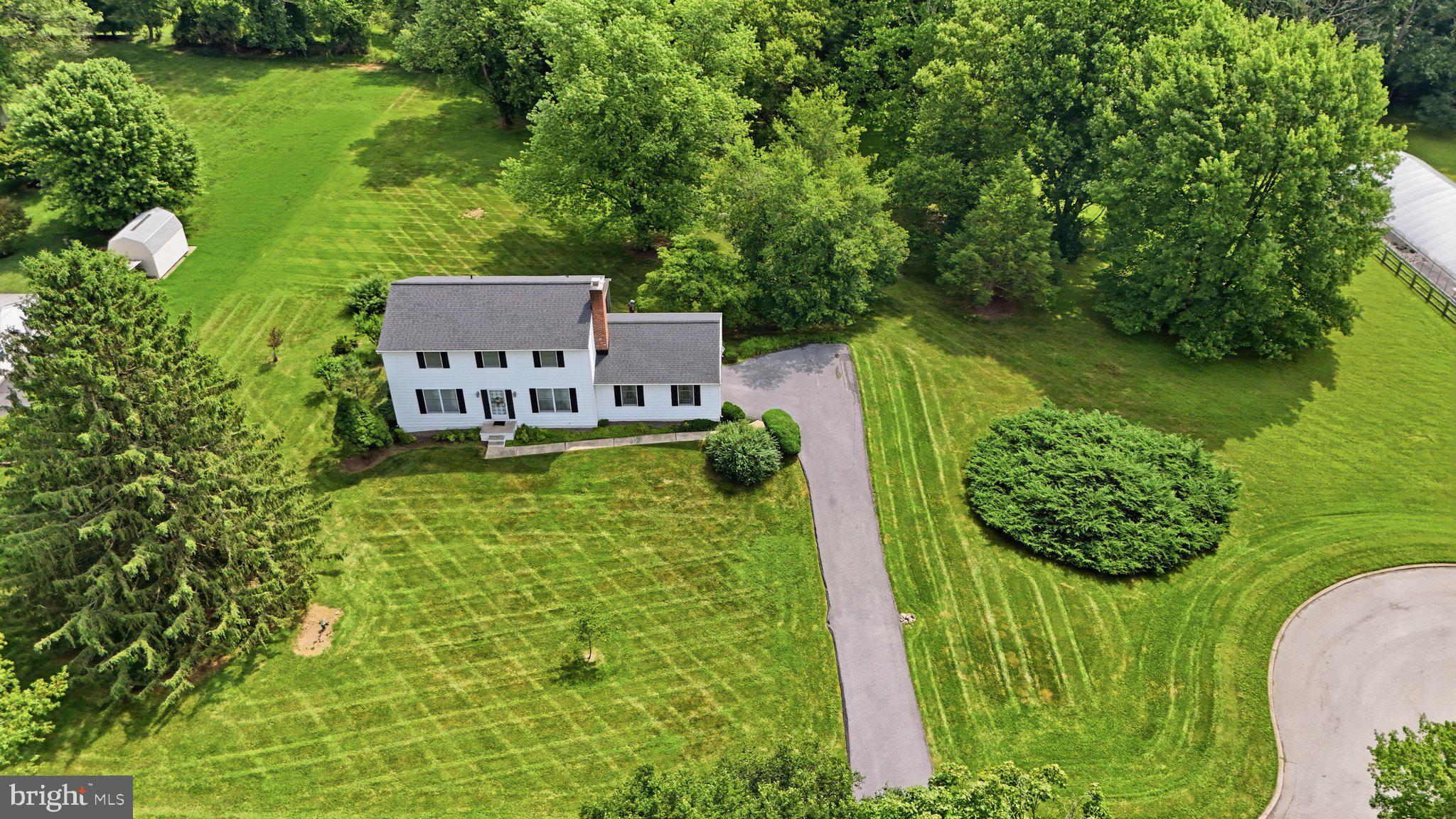 Welcome to this beautifully maintained 4-bedroom, 2.5-bath detached home, perfectly situated on just over 2 private acres at the end of a quiet dead-end street in a peaceful cul-de-sac. Offering the ideal combination of privacy, space, and convenience, this exceptional property is located within a highly sought-after school district and provides easy access to major commuter routes.
Inside, you'll find timeless true hardwood floors throughout the main and upper levels, creating a warm and inviting atmosphere. The traditional floor plan features spacious living areas centered around a classic wood-burning fireplace, perfect for relaxing or entertaining. The  kitchen includes newer appliances and offers both functionality and style.
Upstairs, the generous primary suite and three additional bedrooms are complemented by two full bathrooms, while a convenient half bath serves the main level.
Enjoy outdoor living year-round from the expansive screened-in porch overlooking the private backyard. Additional highlights include an oversized side-entry two-car garage with a blacktop driveway, a partially finished basement with abundant storage space, a newer roof, newer HVAC, new garage door, and a water softener system.
If you've been searching for a home that offers privacy, quality updates, generous living space, and an unbeatable location with no HOA.  This property is ready to welcome you home.