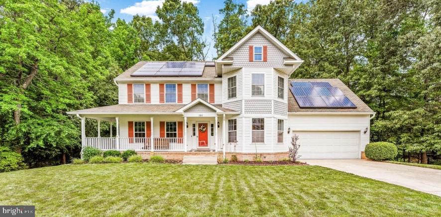 Beautiful 5-bedroom, 2.5-bath Colonial offering space, comfort, and thoughtful updates throughout. A charming wraparound porch creates welcoming curb appeal and the perfect place to relax outdoors. Hardwood floors complement the main living areas, while the updated kitchen features stainless steel appliances, a subway tile backsplash, and a peninsula with seating ideal for casual dining and entertaining. Gather around the fireplace in the inviting living room or enjoy peaceful views from the deck overlooking mature trees. The spacious primary suite includes a walk-in closet and a soaking tub. The finished basement, completed in 2026, adds valuable living space and new carpet. Major updates include HVAC with dual thermostats and venting system (2021) and water heater (2020).