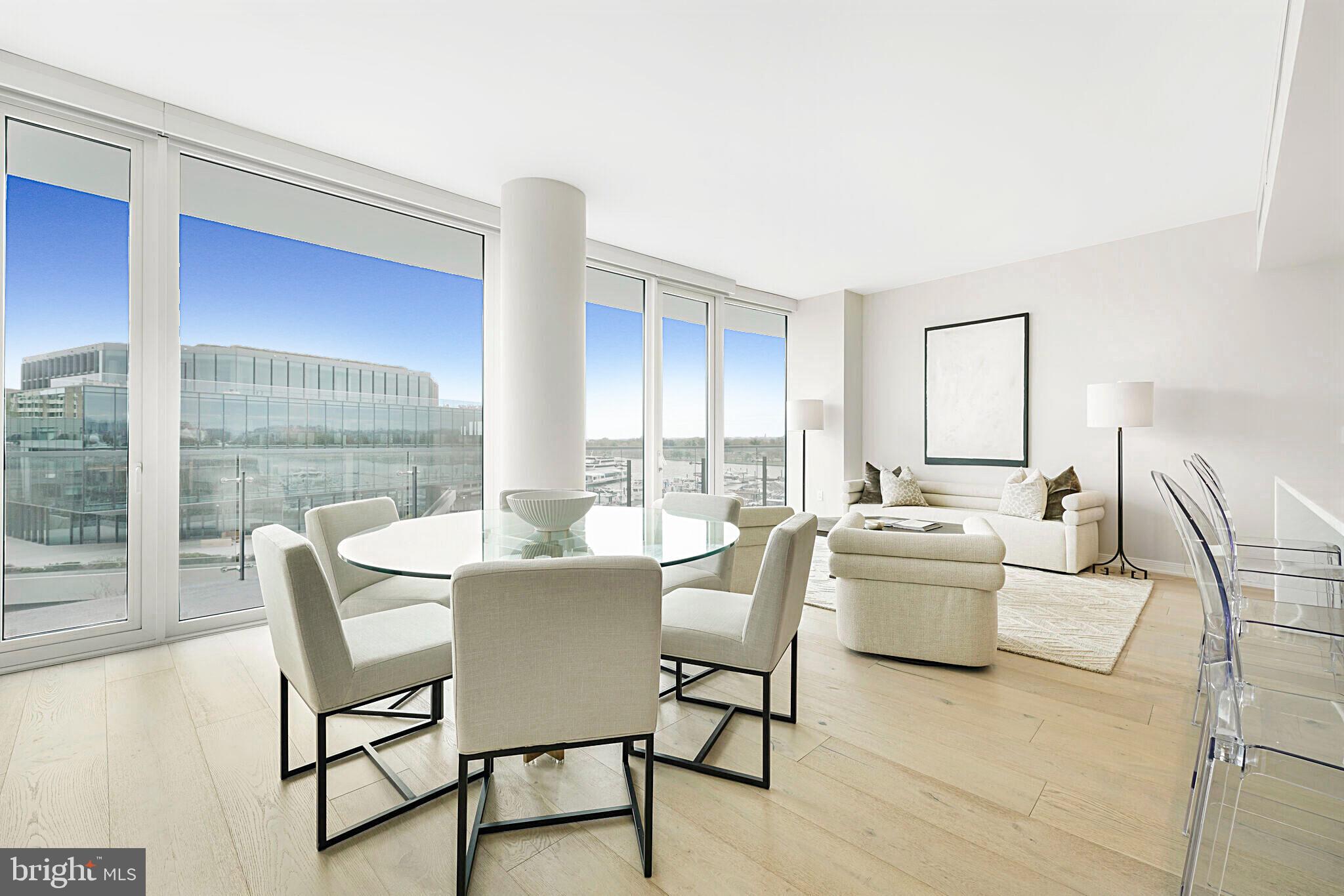 Prominently positioned above the Wharf with breathtaking views overlooking the Potomac River, 601 Wharf St SW #502 has been curated for the most discerning tastes. Located in the Amaris Condominium, designed by renowned architect Rafael Viñoly, this exquisite condo has 2 beds/ 2.5 baths and over 1,500+ square feet of living space. Inside, a private in-unit elevator entrance sets the tone for the unit providing a luxurious arrival. Around the corner, an expansive and light-filled living and dining room features French oak hardwood floors, an incredible private terrace and automated shades throughout.  The gourmet kitchen is a chef's delight with custom cabinetry and stunning marble countertops. The spacious primary suite includes terrace access, a gracious dressing room and a spa bath replete with imported stone, walk-in shower, and large soaking tub . The second bedroom with ensuite, has dual closets and ample space for guests. Two parking spaces complete this exceptional offering. Amaris provides its residents many wonderful amenities including concierge, valet, pool + sauna, building gym, community lounge, and rooftop with grills. Conveniently located at the Wharf, steps to numerous restaurants, shopping, and nightlife.