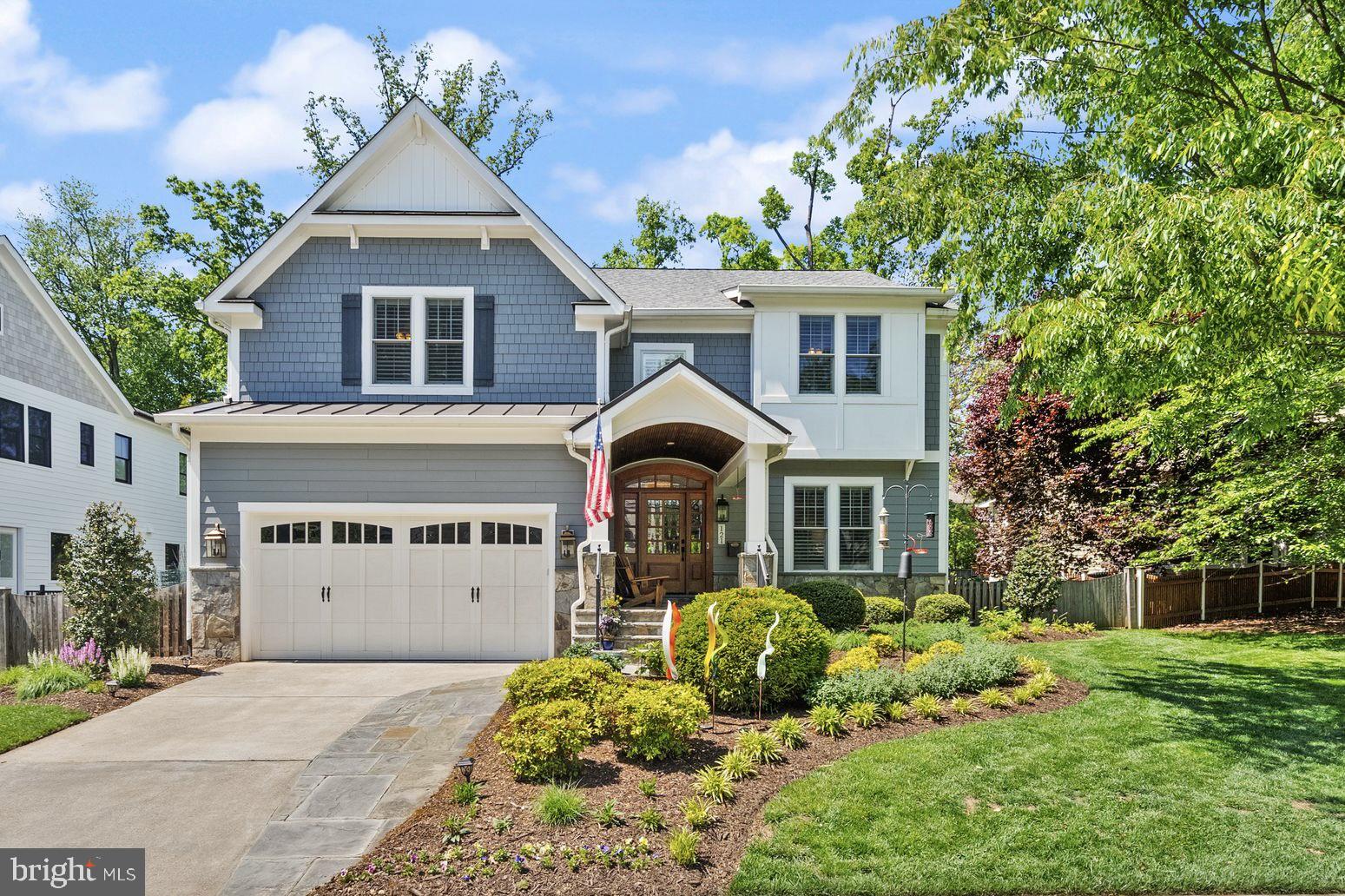 Welcome to 121 Tapawingo Rd SW, a custom-built Fisher home gracefully set on a picturesque, flat .23-acre lot in the heart of Vienna.

Offering nearly 5,000 square feet of thoughtfully designed living space, this 5-bedroom, 4.5-bath residence blends timeless craftsmanship with modern comfort. Rich hardwood floors span the main and upper levels, complemented by custom built-ins, plantation shutters, and woven wood shades that add warmth and architectural interest throughout.

Designed for both everyday living and effortless entertaining, the open-concept layout flows seamlessly from formal to casual spaces. The gourmet kitchen serves as the centerpiece, featuring an oversized island with seating, stainless steel appliances, and a sunlit breakfast area. Just off the oversized two-car garage, a spacious mudroom provides practical organization for today’s busy lifestyle.

Upstairs, the primary suite offers a true retreat, complete with a spa-inspired ensuite bath featuring a soaking tub, expansive walk-in shower, and dual vanities. Three additional bedrooms, each with ensuite bath access.

The lower level is designed for entertaining and relaxation, showcasing a wet bar, custom 200-bottle wine cellar, fifth bedroom, and full bath.

Outdoors, the fully fenced backyard offers a private setting with space to garden, play, or unwind—complete with a dedicated garden area.

Ideally located just moments from downtown Vienna, parks, dining, and commuter routes, this exceptional home delivers the perfect balance of luxury, comfort, and convenience.