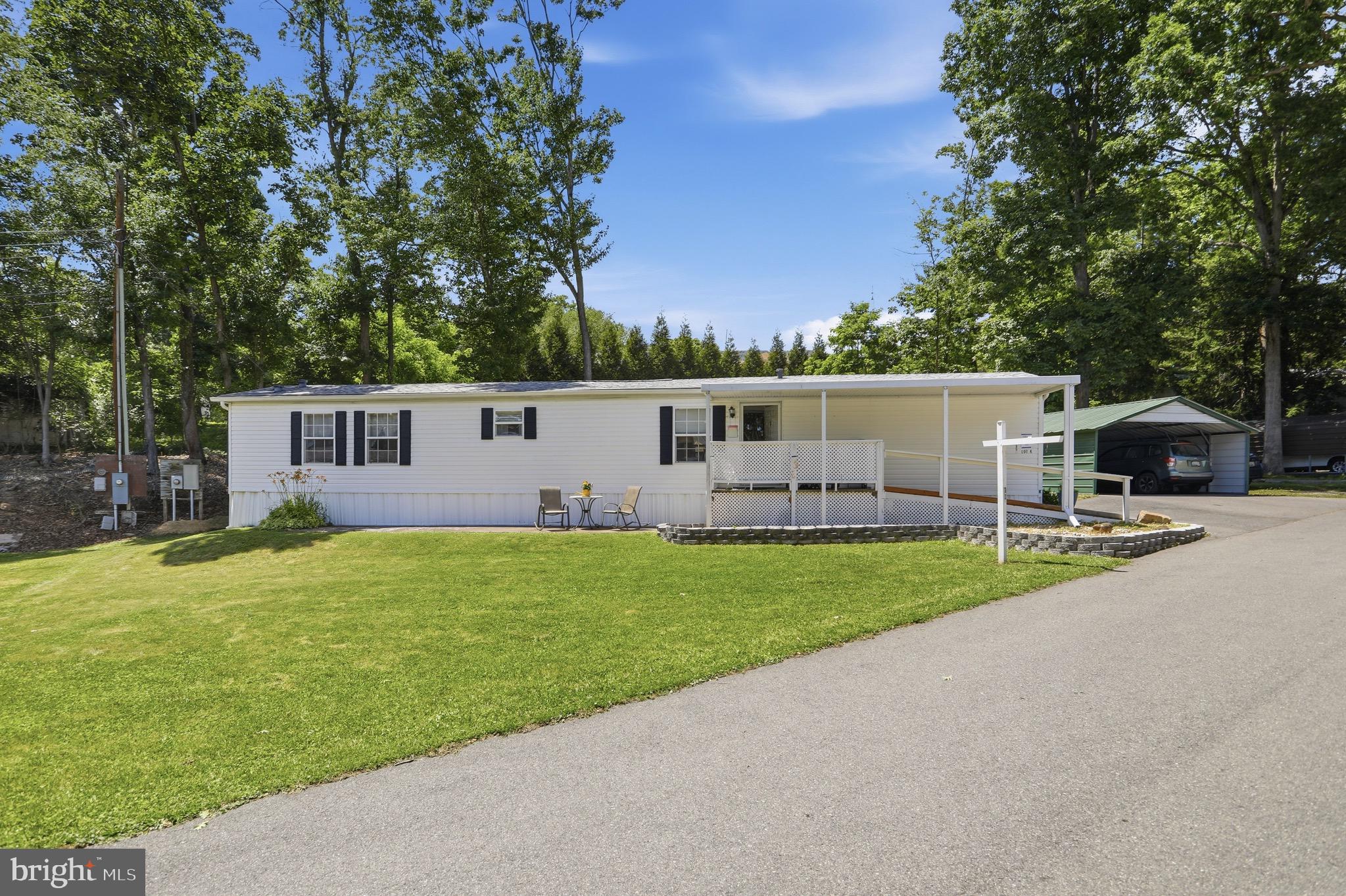 Welcome home to this charming 2-bedroom, 2-bath manufactured home in the heart of LaVale!It is sitting on a triple lot, offering comfortable one-level living, this well-maintained property features a wheelchair-accessible ramp for added convenience, a spacious carport to keep your vehicle protected year-round, and a storage shed perfect for tools, hobbies, or extra belongings. Whether you're looking for your first home, downsizing, or seeking an affordable, low-maintenance lifestyle, this property offers comfort, functionality, and value. The roof is 6 years old, new roof on the shed in 2025, and a new wheelchair ramp added in 2025. Conveniently located near shopping, dining, and everyday amenities, this is an opportunity you won't want to miss. Schedule your showing today!

Lot rent is $295 which includes water, sewage, garbage, road maintenance, and 10% going to taxes.