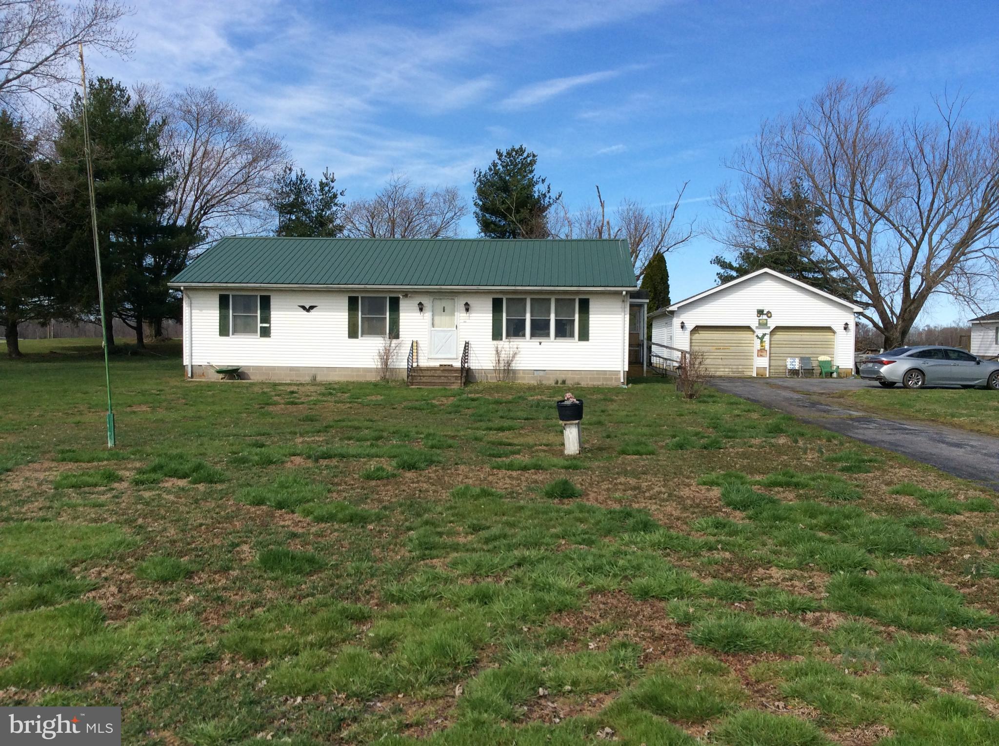 Country living at it finest!  Located on country road with very little traffic with easy access to Delaware, North Kent County Maryland or Delaware.  Home is an original 1979 Nanticoke Home. Very solid home having 3 Bedrooms, 2 Full Baths, Heat Pump and Central Air, Attic with storage all on concrete foundation, Vinyl siding, and Metal Roof only 6 years old with ramp to side door if needed.  Two car detached garage with 100 Amp service, 2 doors, concrete floor and some storage above.  Let the children and pets play without having to worry.  Easy to show.  Call me for your private showing.