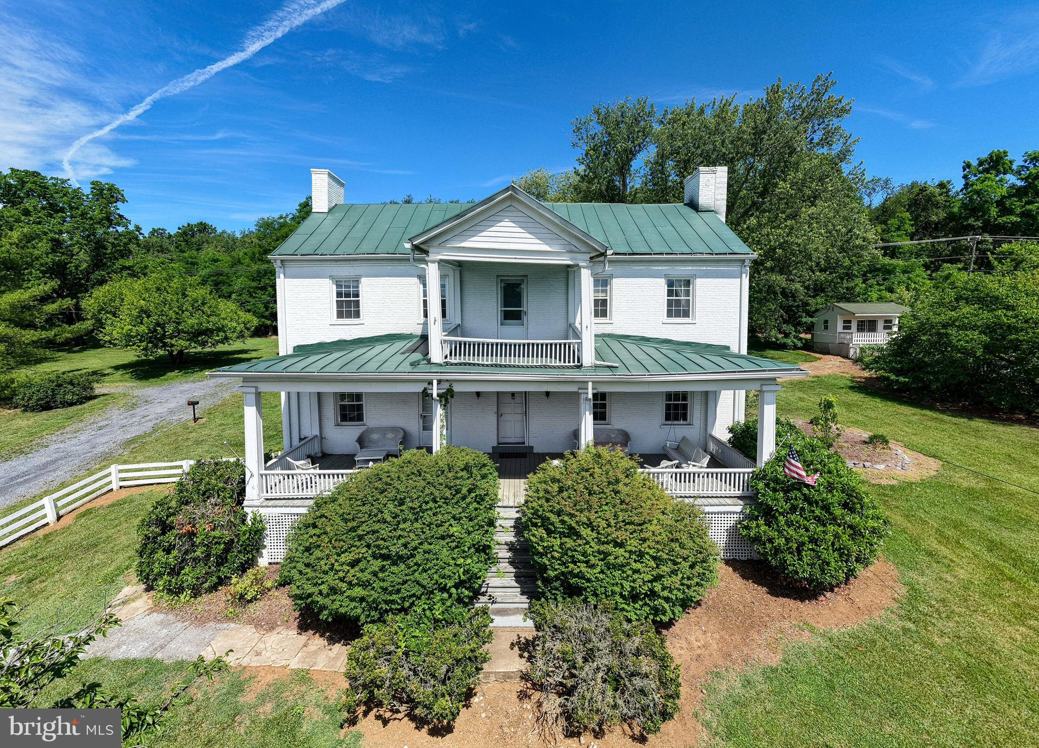If these walls could talk, they'd tell the story of travelers, stagecoaches, and more than two centuries of Shenandoah Valley history.
Known as the historic Crabill Tavern, this remarkable Federal-style landmark once served travelers journeying along the Valley Pike, offering food, lodging, and hospitality long before modern highways existed. Later operating as a hotel, the property remains a rare opportunity to own and preserve a true piece of Shenandoah County history.
Today, the home stands on 4.99 acres and offers over 3,500 square feet filled with character that simply cannot be replicated. Original hardwood floors, spacious rooms, fireplaces, and historic architectural details showcase the quality craftsmanship and timeless character that have allowed this home to thrive for more than two centuries. Every room reflects the character and authenticity that make historic homes so special.
The property extends well beyond the main residence. An attached one-bedroom cabin with an additional bathroom provides flexible space for guests, extended family, a private office, or creative pursuits. Outside, a large barn, in-ground pool, and pool house complement the grounds, creating endless possibilities for entertaining, hobbies, restoration projects, or simply enjoying the beauty of the Shenandoah Valley.
Whether you're drawn to the home's fascinating history, historic architecture, or the opportunity to become the next steward of a local landmark, the Crabill Tavern offers something truly rare: the chance to own a property that has been part of the Valley's story for generations and is ready for its next chapter.
Property is being sold strictly as-is, where-is.