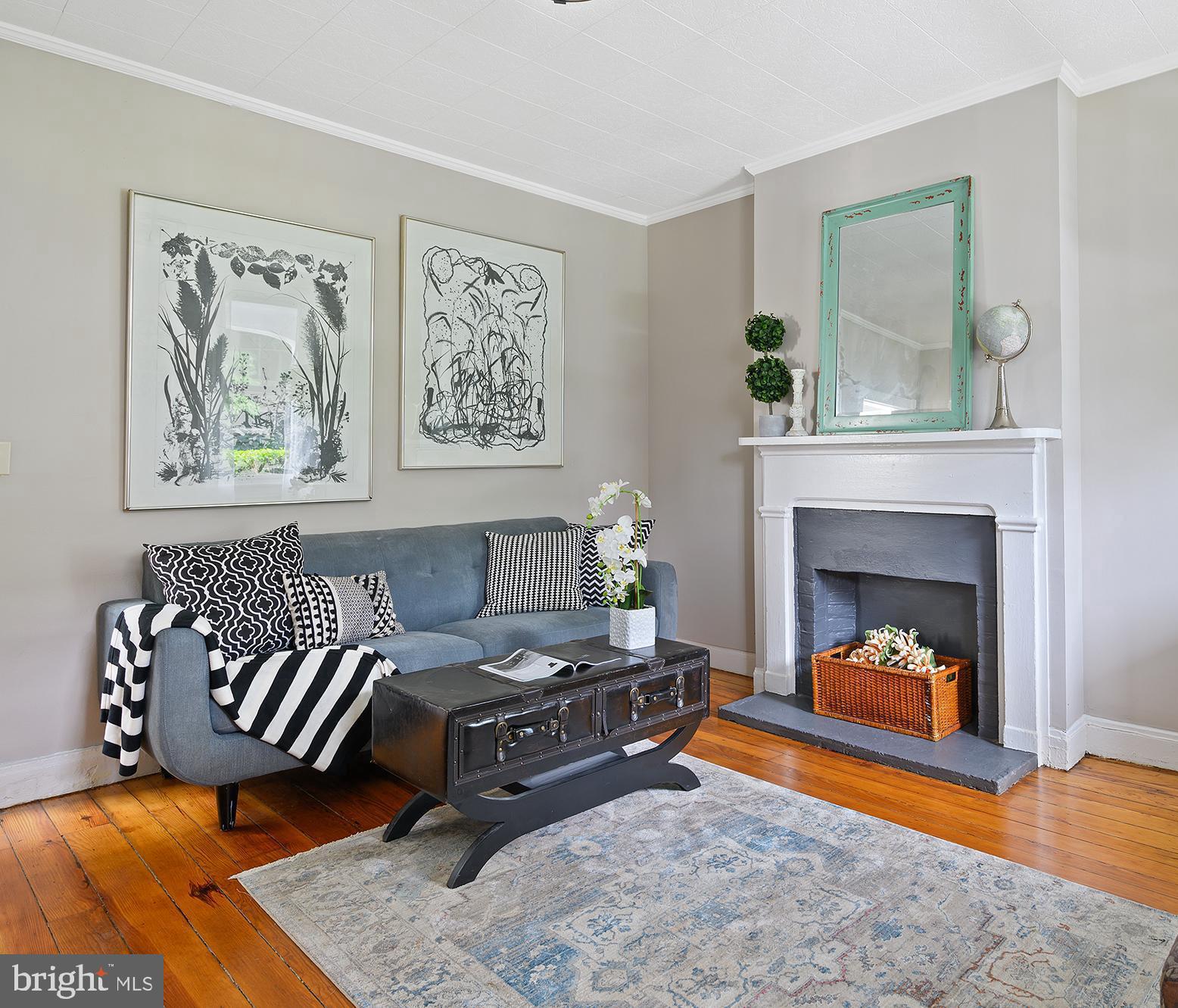 Excellent new price! Now offering credit for a preferred lender 2/1 Buy-Down. The 2-1 temporary buy-down will reduce buyer's interest rate 2% in the first year and 1% in the second year. Own a piece of historic Hampden. Happy, light-filled 1870 semi-detached. Huge backyard—grow vegetables in the city! Two-story garage outbuilding—renovated (non-parking) garage with electric and separate meter is an ideal rental income opportunity. Below is an open space perfect for gardeners, ceramists, painters. And now with a one-point loan reduction with the participating lender Renovated, but still showing character and charm. 1,764 spacious square feet of living space—plenty of room to spread out for all your interests and hobbies. So many creative possibilities in this property! Enjoy as is, or make small changes to make it your own. Great location near the Avenue, Woodbury, bike to MICA, JHU.