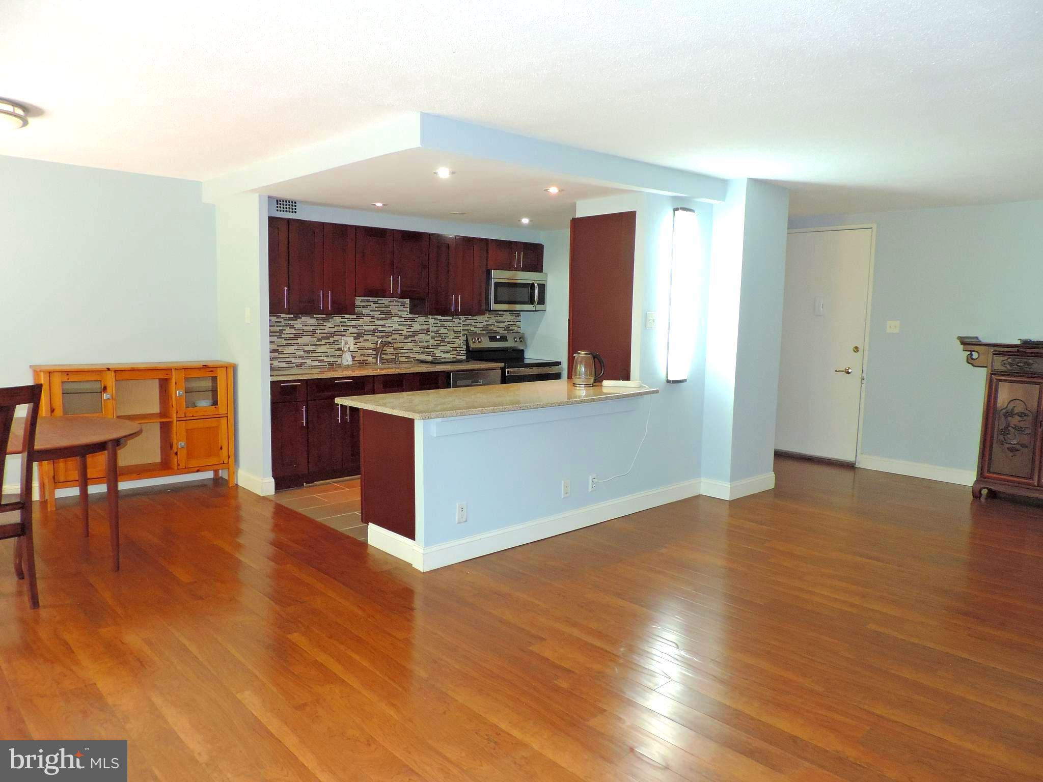 This 2-bedroom unit on the 9th floor of East Building in that all famous Green Hill Condo,  or known as 1001 City Ave, is located on south bright side with a balcony off dining room overlooking open space and wonderful tree views. The unit was total renovated with open concept floor plan, laminate flooring and newly natural painting throughout entire unit. the kitchen opens to family room and dining room, featuring with large island, newer cabinets, flooring, granite counter tops and stainless-steel appliances. Two great size bedrooms have own renovated bathrooms, and spacious walk-in closets. The hallway provides even more storage and a laundry area. In this community, condo fees cover almost everything from ground maintenance, tennis court, 24/7 door man and onsite management to water, sewer and electricity. the only item you need to pay out of your own pocket is internet/cable TV. The Greenhill shuttle service is available to residents for easy access to shopping centers, grocery stores, Lankenau Hospital and R5 train station to Center City. The condo is in the award winning Lower-Merion school district.