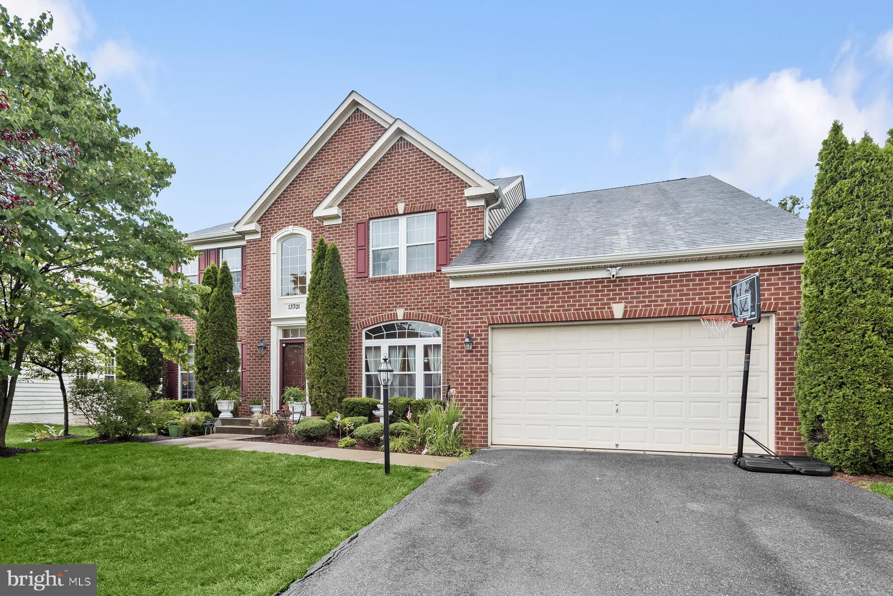 Welcome to this gorgeous home that is pride of the neighborhood! This renovated home provides ample space for family living and entertaining. It features high ceilings, large windows, a finished walk-out basement with a second kitchen, sunroom and deck off the main level, and an open floor plan suitable for modern living. The 2-story foyer leads to a living room and formal dining room, both with appealing features. The main level, with beautiful floors and fresh paint, is well-lit. The kitchen includes quartz countertops, and an oversized island, stainless-steel appliances, ample cabinetry, and a good-sized pantry. Connecting to the kitchen is a family room with a fireplace and a sunroom that leads to a large trek deck, patio and the private backyard. The main level also includes an office, a powder room, a mudroom with laundry, and access to a two-car garage. Upstairs, four spacious bedrooms and two full baths await. The primary bedroom has a large walk-in closet and a luxurious bathroom with dual vanities, a walk-in shower, and custom tile. The fully finished walk-out lower level offers additional recreation space, a kitchen with granite counters, a bedroom, a bonus room, a full bath, and a storage/utility room. Conveniently located in an exclusive neighborhood – close to stores, restaurants, entertainment and recreation options. Commuters delight - a quick drive to Annapolis, Baltimore, and DC!