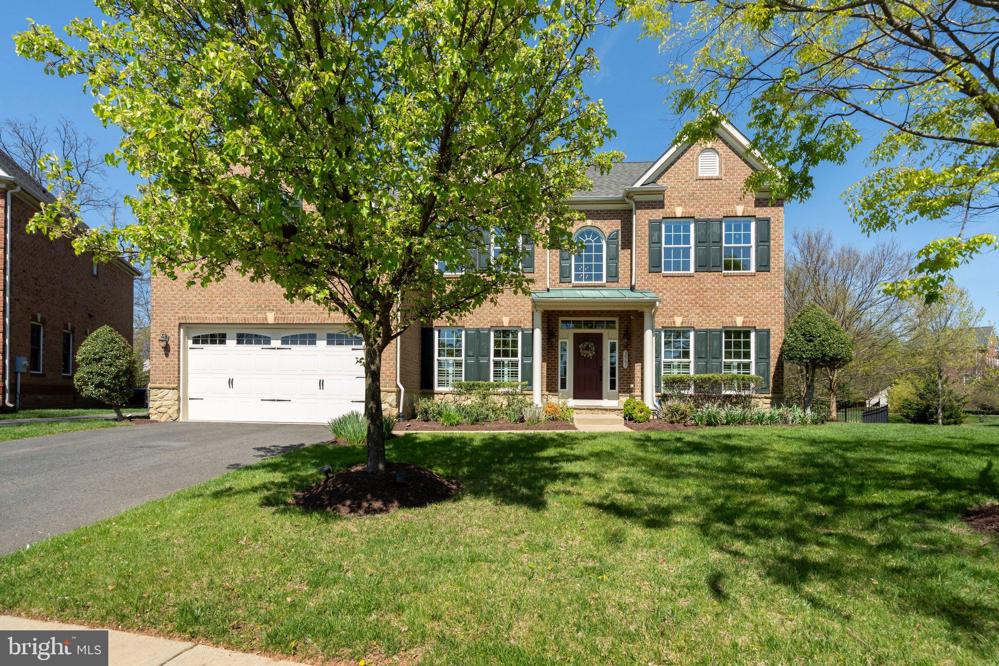 Introducing an exceptional residence in the highly sought-after Fairfax community of Kensington Square. This rarely available, stunning single-family home features 4 sides of brick construction, 5 bedrooms, 4.5 bathrooms, and over 5,400 square feet of luxurious living space. Built in 2011 by NV Homes, this Remington Place model is situated on a premium lot that backs onto a serene wooded area.  Check out the 3-D and video tours to understand the elegance and beauty of this home.

This home is move-in ready and designed for convenience. Enjoy a low-maintenance lifestyle in this outstanding neighborhood, where the active HOA takes care of lawn care, exterior painting, gutter cleaning, and more! Step into the main level's 2-story foyer and admire the newly refinished, gleaming hardwood floors that flow throughout the space. The home has been freshly painted in a modern palette, with custom plantation shutters and new LED recessed lighting enhancing its aesthetic appeal. 

Elegant formal living and dining rooms flank the foyer and lead into the impressive 2-story family room, which features a handsome stone fireplace that adds warmth to the living area. The gourmet kitchen boasts stainless steel appliances, granite countertops, custom cabinetry, a glass backsplash, and a spacious center island. Adjacent to the kitchen is a charming dining area that overlooks the scenic views of the backyard.

French doors off the family room lead to a convenient home office. The second-story overlook opens to the luxurious master suite, which offers a spacious layout, a tray ceiling, and plush carpeting. The well-appointed primary bathroom includes dual vanities, a walk-in shower with body sprays, and a soaking tub. The three additional bedrooms are generously sized and serviced by two full bathrooms.

The lower level features a large recreation room, offering endless possibilities for customization and personalization. The fifth bedroom and ensuite bathroom are perfect for accommodating guests or family. Additionally, a storage room with built-in shelving and a bonus room provide practical spaces for organization and expansion.

The exterior of the property is just as captivating, with a charming stone patio and a fully fenced, lush yard—ideal for outdoor gatherings and enjoying the beauty of the wooded landscape. Community amenities include a basketball court, playground, walking and jogging paths, and landscaped parks. A membership to the Greenbriar Pool Club is also available.

The prime location of this property ensures convenience and accessibility. Experience a variety of dining and shopping options, and enjoy proximity to major roads, Fair Oaks Hospital, and the International Country Club. Everything you need is within reach, making this home an ideal choice for those seeking a well-rounded and vibrant lifestyle.