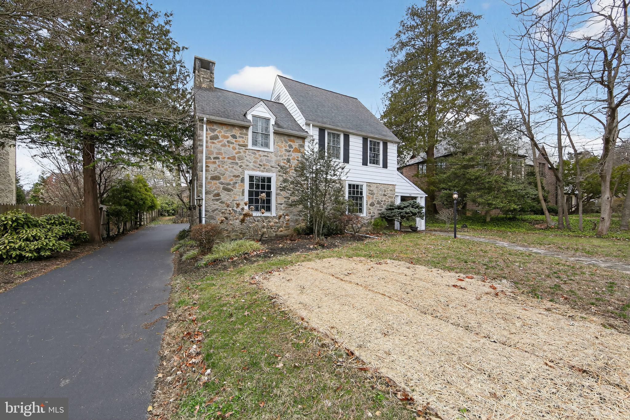 Welcome to this Story Book Home in Downtown Wayne, Radnor Township.  This lovely 4 Bedroom Stone Colonial offers a most discriminating  Buyer their Classic Home, with Elegant Finishes, Spacious Rooms, a Private Yard - all in a Walk to Location.  Charm has not been stripped away with upgrades to this home.  Set on a coveted Radnor Township road, this classic home offers gracious main floor living infused with timeless architectural details and thoughtfully designed indoor-outdoor flow. With original hardwood floors to gently guide your way through the home, the warm foyer and main hall anchor the spacious elegant living room with large windows and brick fireplace with wood stove insert to the gracious formal dining room with original woodwork and corner glass cabinets, and blends in with the kitchen.  Three sets of doors open directly to serene stone porches and patios, seamlessly blending indoor comfort with outdoor relaxation. The custom eat in kitchen is a chef's delight, Beautiful cabinets from Peterson's kitchens, Viking Gas Range with Viking Exhaust, 36" Subzero Refreigerator/Freezer and soap stone countertops.  A laundry/mudroom is adjoining the kitchen provides access to the side patio, a rear staircase, and the full basement.  A lovely staircase from the main entrance hall leads you to the second level with four beautiful timeless bedrooms and two full bathrooms.  Most of the windows have been upgraded to Pella Architectural Series in keeping with the homes original character.  This exceptional property offers refined living, quality craftsmanship, and enduring charm in Radnor Township’s most desirable Downtown Wayne neighborhood. Schedule your private showing today to see this lovely home for yourself.