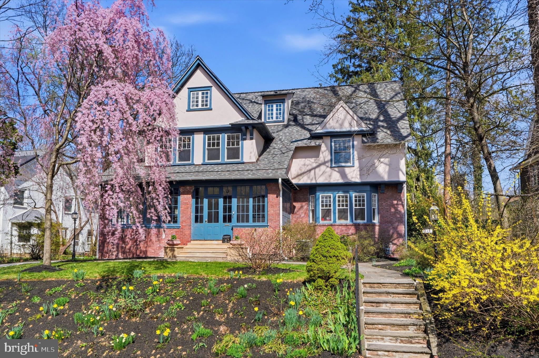Welcome to 313 Berkeley Road, an impeccably maintained Colonial residence nestled on one of the area’s most desirable streets in the highly sought-after Lower Merion School District. Set on a flat and beautifully usable 0.3-acre lot in Merion Station, this expansive home offers over 4,200 square feet of living space with 6 bedrooms and 3.5 bathrooms, seamlessly pairing old-world charm with thoughtful modern conveniences. From the inviting front porch, enter a gracious layout that unfolds from a large foyer into bright living spaces brimming with historic details like original bay windows, hardwood floors, and crown molding. The main level features a formal living room anchored by a gas fireplace, a spacious dining room with an adjoining butler’s pantry, and abundant windows that fill the home with natural light. The updated eat-in kitchen boasts granite countertops, a large center island, and stainless steel appliances, and provides easy access to a large back patio framed in greenery, perfect for outdoor dining and entertaining.
The upper levels offer versatile living spaces that accommodate work-from-home needs, multi-generational living, or room to grow, with fully renovated bathrooms, a primary suite with an ensuite bath, and charming window seats to enjoy the updated windows. A finished basement adds even more functional space to spread out. Outside, enjoy curated gardens providing year-round color, old-growth trees that keep the lot cool in the summer, an EV charger, and a recently rebuilt 2-car garage. Situated on a picturesque, low-traffic street, the home offers a true sense of community complete with friendly neighbors and annual block parties. From your front door, walk to the vibrant heart of Narberth, Merion Elementary School, or the Merion train station. This is a home where space, character, and location come together– a rare offering that blends the best of past and present in a way that’s increasingly hard to find in one of the Main Line’s most desirable locations.
