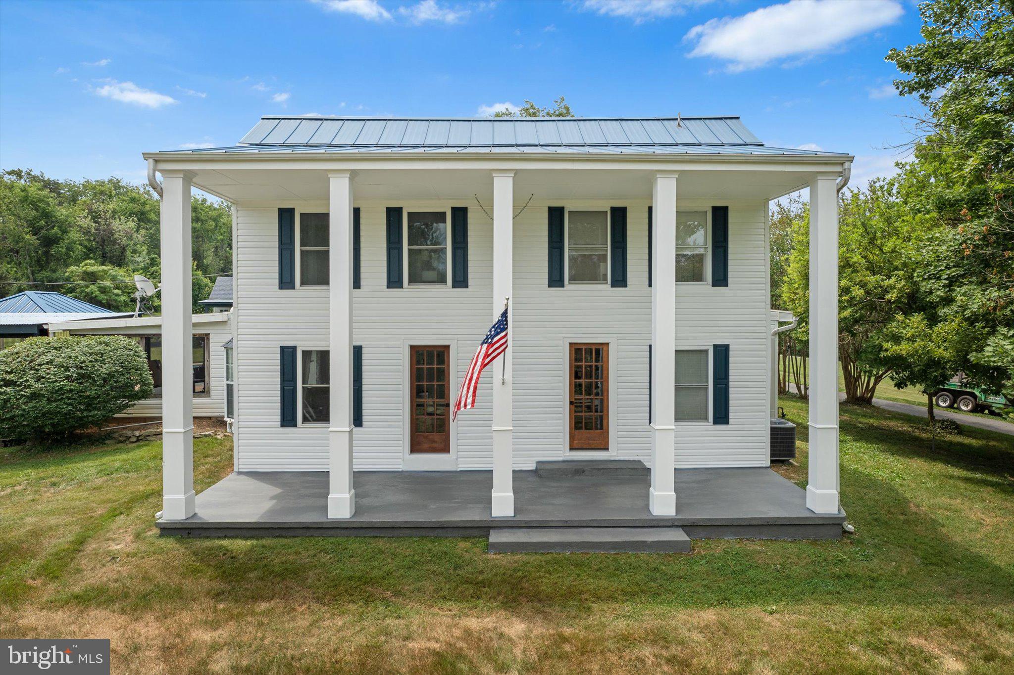 Set on a picturesque 1.68-acre property, this thoughtfully updated southern colonial combines timeless character with extensive modern improvements, offering a private retreat with exceptional indoor and outdoor living spaces. Carefully enhanced over the years, the residence provides a blend of comfort, functionality, and versatility for everyday living and entertaining.

Inside, the home showcases extensive renovations completed in 2021 and 2022, including refinished original hardwood flooring, updated trim work, remodeled living spaces, and a beautifully renovated upper-level bath. The main living areas offer a warm and inviting atmosphere with a seamless balance of classic charm and contemporary finishes. Additional upgrades include new hardwood flooring throughout portions of the home and luxury vinyl plank flooring in the primary bedroom and laundry area.

Outdoor living is a highlight of the property. The screened porch and outdoor kitchen were extensively remodeled in 2021, creating an ideal space for dining, entertaining, and enjoying the surrounding landscape. The backyard is centered around a beautifully resurfaced pool with updated tile, completed in 2020, providing a resort-like setting for relaxation and recreation.

Adding to the property's versatility is a detached office or pool house, renovated in 2022 and equipped with a dedicated mini-split system, two French doors, and a sliding glass door. This flexible space is ideal for a home office, creative studio, fitness area, or hobby room. Also completed in 2022, the detached workshop/garage features electrical service and a loft, offering abundant space for projects, storage, equipment, or vehicle parking.

Additional major improvements include roof updates with new shingles and a new flat roof section over the sunroom, a full electrical panel upgrade, a tankless water heater, and a resurfaced and expanded driveway. Garage has been converted into livable space adding roughly 490sq of living area. Pool house is approximately 279 sq ft and air conditioned. Recent exterior enhancements include refreshed front siding and refurbished front doors and shutters, further contributing to the home's curb appeal.

Surrounded by open space and mature landscaping, this 1.68-acre property offers a rare combination of privacy, updated amenities, flexible outbuildings, and outstanding outdoor living areas. Thoughtfully maintained and extensively improved, it presents an exceptional opportunity for those seeking space, comfort, and modern convenience in a beautiful setting. Home percs for 3 bedroom.