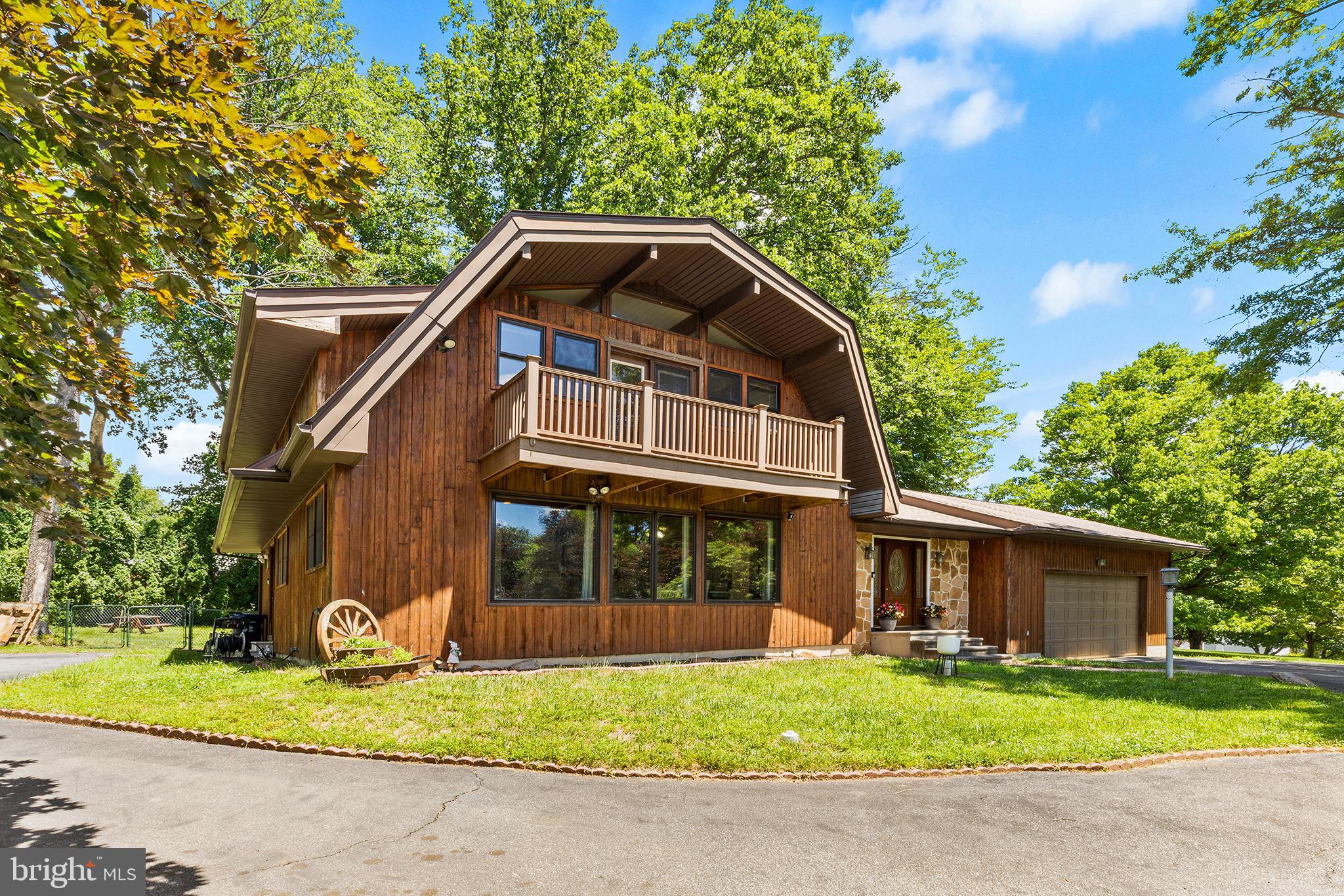 Welcome to 2 Fox Run, a beautifully situated contemporary home nestled on a private, tree lined, nearly one-acre corner lot in the highly sought-after Garnet Valley community. This charming residence offers the perfect blend of space, comfort, and convenience in an exceptional location.

Featuring 3 bedrooms, 2.5 bathrooms, and approximately 2,090 above grade square feet of living space, plus additional finished basement, this home offers comfortable everyday living with plenty of room to entertain. The inviting floor plan is enhanced by abundant natural light, spacious living areas, gorgeous natural hard wood, and stunning architectural details throughout.

The kitchen provides ample cabinet and workspace and flows seamlessly into the dining and gathering areas, making it ideal for hosting family and friends. Upstairs, the generously sized bedrooms offer peaceful retreats, each highlighted by beautiful, exposed wood beams that add warmth and character to the home's contemporary design. The spacious primary suite features an en-suite bath and balcony—the perfect place to enjoy your morning coffee or unwind at the end of the day.

The finished lower level expands the home's living space and serves as the perfect entertainment destination, featuring a bar area, comfortable seating, and plenty of room to gather for game days, movie nights, or casual get-togethers. Additional unfinished basement space provides excellent storage options.

Additional highlights include an attached two-car garage that is large enough for a lift and extra storage and also has an outlet for an electric car charger. The home also has a beautiful outdoor setting with mature landscaping, oversized deck, fenced in back yard, and room to enjoy all seasons.

Located within the award-winning Garnet Valley School District and just minutes from shopping, dining, parks, and major commuter routes to Philadelphia and Wilmington, this property combines suburban tranquility with everyday convenience.

Don't miss the opportunity to make this exceptional Garnet Valley home your own.