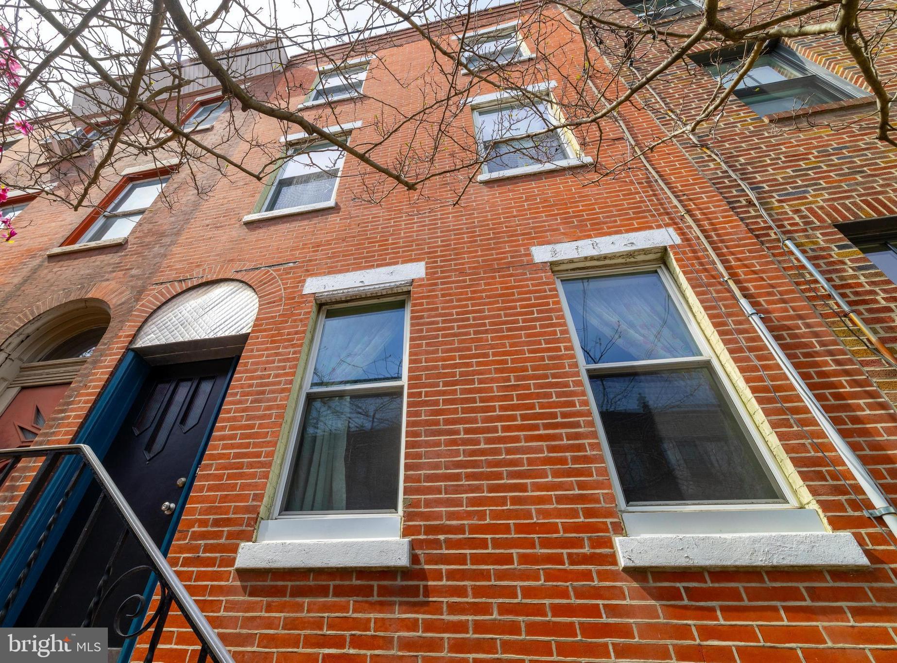 Step into this expansive 6-bedroom, 2-bath home, a unique opportunity nestled on one of Passyunk’s most desirable streets. Located within the coveted Fanny Jackson Coppin school catchment and adjacent to  redesigned Columbus Square, this property offers charm, awesome location, large square footage and tones of potential.
With its original brick front and preserved architectural details—such as vintage doors, moldings, and railings, high ceilings and large rooms—this home exudes character while presenting a blank slate for your vision. The large backyard is a rare find, ideal for entertaining or creating your private oasis.
While the home is in need of cosmetic updates, it boasts great development potential for those looking to create something extraordinary or move right-in a grand charmer! Its prime location provides convenient access to Center City, vibrant Passyunk shopping, schools, and public transportation.