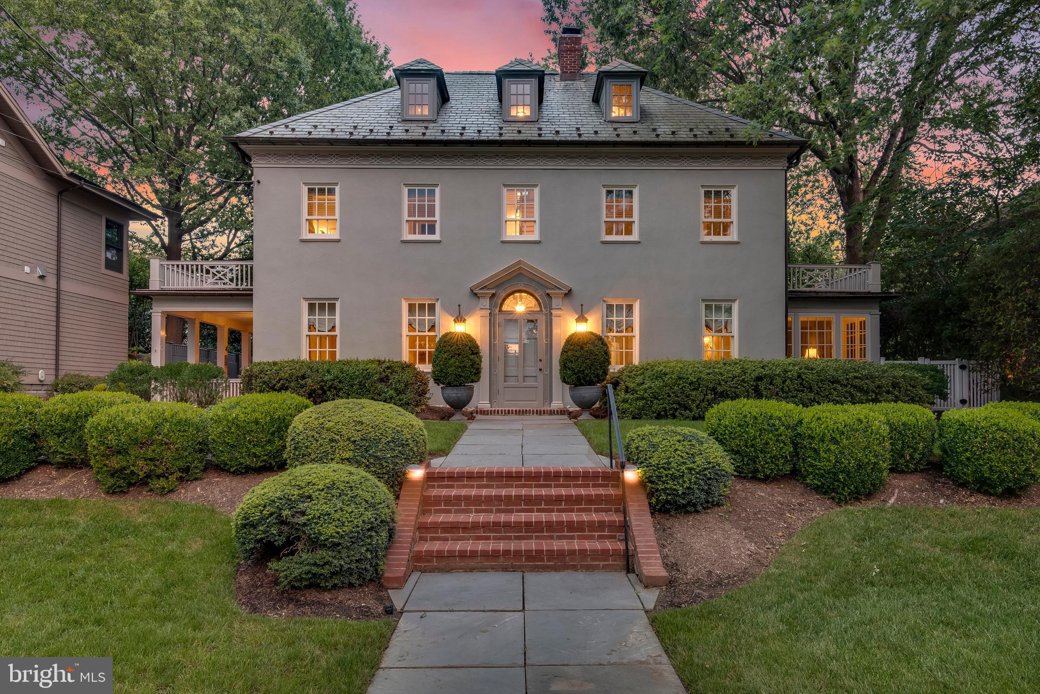 This 4 BR residence offers beautiful architecture, Colonial/Georgian Revival charm and  timeless details. Large terrace, a lovely patio, covered porch, detached two car garage with mahogany door & electric car charging station, and an expansive driveway with private off-street parking.  Nine foot high ceilings, Original Hart of Pine hardwood flooring, picture molding, and a gas fired masonry fireplace.  The  kitchen features granite countertops, island, quality custom cabinetry, stainless steel appliances and a light filled eat-in breakfast room.  Primary bedroom suite includes 9ft ceilings, moldings, sconces & full bath with walk in tile shower & radiant heated floors.