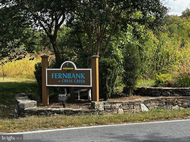 Tucked within one of the Eastern Panhandle’s most sought-after communities, Lot 107 on Reachcliff Drive presents a once-in-a-generation opportunity to build your custom home in Fernbank—known for its natural beauty, welcoming neighbors, and golf course setting. This lot provides 89' of frontage along the 5th fairway. 

Positioned at the highest elevation in the neighborhood, this wooded lot offers spectacular views of the Cress Creek Golf Course and protected countryside beyond. Located on a quiet cul-de-sac, Reachcliff Drive is prized for its peaceful atmosphere and refined homes valued up to $1M.

With public water, sewer, and cable available, and a topography that supports a sunny walkout basement, this lot is ready for your architect and builder. The generous depth allows for privacy while still enjoying sweeping views and golf course access.

Just minutes from the Potomac River, downtown Shepherdstown, and MARC commuter rail to DC, Fernbank offers an ideal blend of tranquility and convenience.

Don’t miss your chance to own one of the premier homesites in the region.