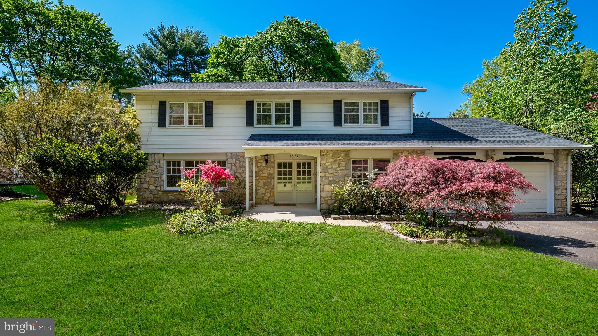 Half Stone front 2-Story Center Hall Colonial with covered front porch opens to large formal tiled entry that flows into the large open eat-in Kitchen. Center hall opens to large Living room featuring a Large picture window inviting in the morning sun and oak hardwood floors. The other side of the entry opens into the formal dining room with hardwood floors and custom millwork. Large family room with triple Anderson slider and full floor to ceiling stone wood burning fireplace. Eat-in Kitchen across from the Family room with peninsula base cabinet opening into the separate eating area with an open view of the private backyard. The Kitchen offers painted wood cabinetry, built-in dishwasher, electric wall oven & gas cook top. Laundry/mudroom off Kitchen with walk in shower and pedestal sink, side door to screened in porch for those great weekend get togethers plus full access to the 2-car garage. Hardwood oak steps to 2nd floor that continue throughout the 2nd floor. 5 bedrooms on the 2nd floor. Huge primary bedroom with large deep walk in closet and primary bath with large Neo Angle walk -in shower and ceramic surround and floors.4 additional bedrooms all with ample closet space, hardwood floors. Hall bath with new quartz countertop and double sink Tub /shower combination with ceramic tile walls and floors. Newer Central Air and high-efficiency Heater. Freshly painted throughout. Partially finished Basement.