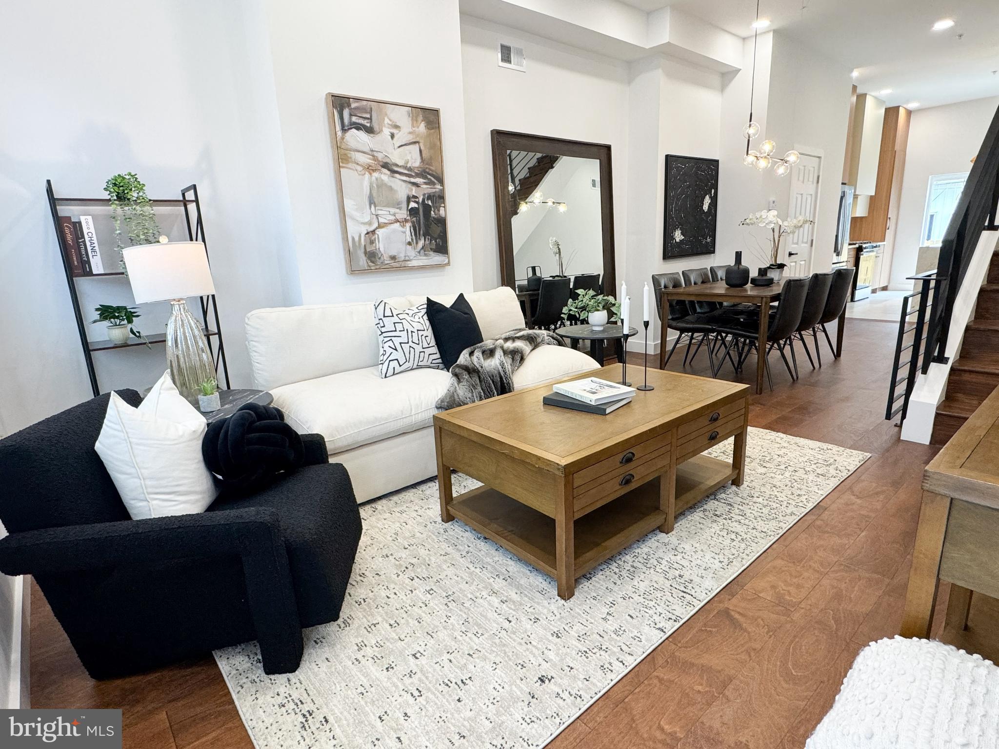 1711 N 4th St is here! — The response to sister property 1709 N 4th St was exceptional, going under contract in less than one week. Don’t miss your opportunity to tour this stunning new construction and make it your dream home before it’s gone! Thoughtfully designed and beautifully executed, this 4-bedroom, 3.5-bath residence blends modern luxury with warm, Scandinavian-inspired style. This home has a 10 year graduated tax abatement and 1 year builders warranty as well! From the moment you enter, you’re greeted by soaring ceilings and an open, airy layout that sets the tone for the rest of the home. Engineered hardwood floors run throughout, complemented by carefully curated lighting and high-end finishes at every turn. The chef’s kitchen is truly the centerpiece featuring sleek quartz countertops, a stunning waterfall island, premium GE appliances and a statement range hood. An additional breakfast bar with ample storage is thoughtfully outfitted with a pot filler to create the perfect coffee bar setup. Sliding glass doors flood the space with natural light and open seamlessly to the private backyard, creating the perfect indoor-outdoor flow. On the second floor, you’ll find two spacious bedrooms, each with ample closet space, built-in shelving, and beautifully designed en-suite bathrooms. One features a spa-like step-in shower with a built-in bench, while the other includes a tub/shower combination perfect for a nursery or flexible living needs. The entire third floor is dedicated to a luxurious primary suite retreat. This expansive space easily accommodates a king bed, sitting area, and boasts a large step-in closet. But the spa-inspired bathroom is the true showstopper! Featuring a massive step-in shower with a soaking tub, dual shower heads with handhelds, a wall-to-wall bench, and a beautifully appointed vanity it is truly a dream bathroom. Top it all off with a private roof deck offering 360-degree views of the beautiful Philadelphia skyline. The perfect place for entertaining or unwinding above the city. The fully finished basement offers a versatile fourth room, ideal for guests, a home office, or den along with a tiled living space and laundry area with washer and dryer. This Olde Kensington home is just a few blocks from Fishtown and is right near some of the best restaurants, breweries and coffee shops the area has to offer. Easily stroll to places like Human Robot, Rival Bros Coffee Bar, Jaffa Bar, and Kalaya (to name a few).