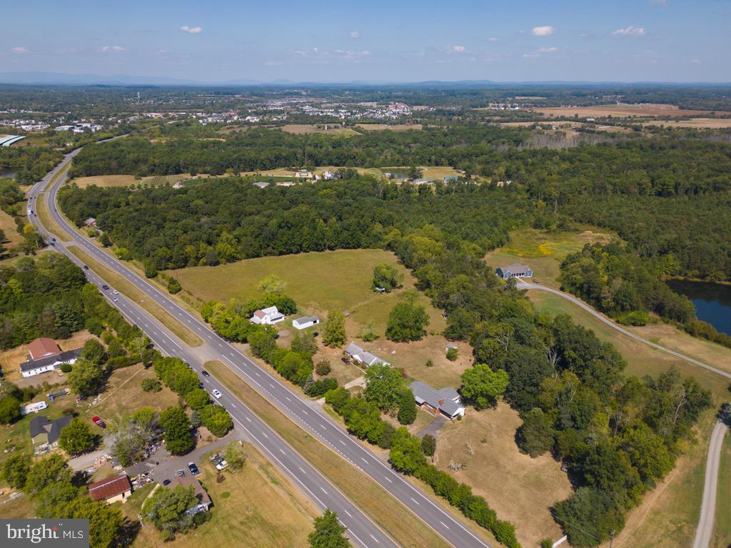 We are thrilled to present to you a rare and remarkable investment opportunity: a family-owned property spanning 109 years, consisting of 20 acres spread across 6 parcels. This property offers a diverse mix of open and wooded areas and boasts over 2000 feet of road frontage, making it an ideal investment for various purposes. 
For over a century, this property has been lovingly owned by a single family, and it is now ready for a new chapter in its rich history. The 20 acres are divided into 6 parcels, offering both versatility and potential for various uses. Currently, there are four houses on the property. Two are occupied, providing immediate rental income, while the other two are ready for new tenants or further development. This property offers excellent accessibility and visibility.
The combination of open and wooded areas presents numerous possibilities for the property's utilization. Whether you envision residential development, commercial ventures, or recreational purposes, this property can accommodate a wide range of projects. With the property divided into six parcels, it is easily sub-dividable, allowing you to tailor your investment strategy to your specific needs.
This property is conveniently located near essential amenities, ensuring a desirable quality of life for potential residents or tenants. With extensive road frontage, the property provides easy access to major transportation routes, enhancing its commercial potential.
Imagine the possibilities of owning a piece of history, transforming this 109-year-old family-owned property into a thriving and profitable venture. Whether you intend to create a housing development, an RV park (no other RV parks within 75-100 miles), establish a commercial enterprise, or maintain it as a picturesque estate, this property is a canvas for your investment vision.
Don't miss out on this unique opportunity to become a steward of this legacy property. The potential for substantial returns, combined with the enduring history and charm of this land, makes it an investment opportunity like no other.
For more information, development prospects, and a personalized tour of the property, please contact us at your earliest convenience. This is your chance to be a part of history and build a legacy of your own.