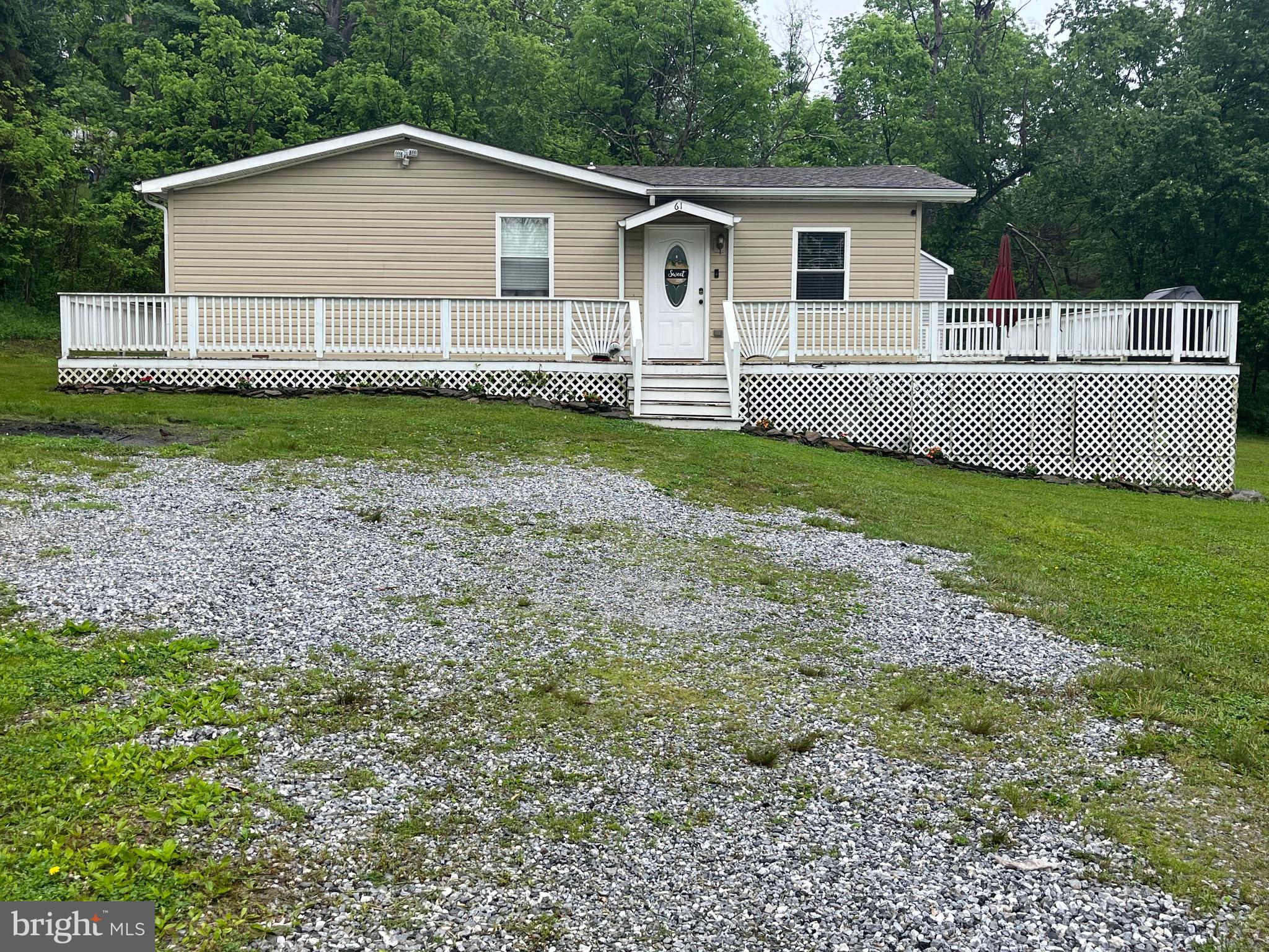 Welcome home to this beautifully isolated Double Wide Manufactured home located on almost an acre of land along the Codorus Creek in Glen Rock, Pa. Enjoy living in your private home with stunning views over your large lot surrounded by Forested land and bounded by a flowing stream. Also there is a beautiful, tranquil fish pond on the property. You will be spending most evenings in the summer sitting on your large wrap around deck enjoying picturesque views of your property. This home is built on a crawl space and contains a large added on family room with its own mini split system for heating and cooling. From this family room you can access the large deck which extends around two sides of your new home. Next as you leave the family room you will enter into the main house with a large kitchen containing ample counter space, a serving bar with additional cabinets and a mini fridge and the kitchen refrigerator and dishwasher. Adjacent to the kitchen is the living room with lots of natural light. The primary bedroom contains a spa like bathroom as well as new carpeting. There are two additional bedrooms as well as a hall bathroom with tub. This home boasts new flooring throughout with LVP in the main living areas and carpeting in the bedrooms. Outside is a new storage shed with a second floor loft for your storage or as a workshop. The washer and dryer are newer and will stay for the buyer's use. The HVAC system has been recently serviced and was fitted with a new motor on the AC system. 
Current owners do carry Flood Insurance and pay approximately $1300.00 annually for this insurance.