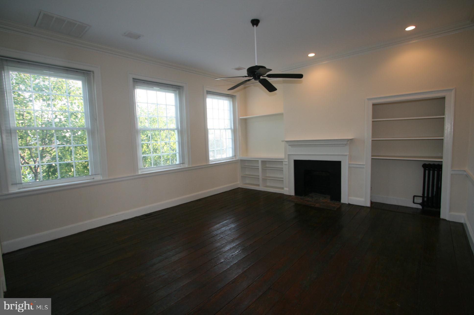 Prime Old Town location. 1600+ square feet of first floor retail with wide plank original hardwood floors, a working gas fireplace, and basement storage. Second floor three rooms office space with wide plank original hardwood floors and a half bath. Third floor large one BR one full bath apartment wide plank original hardwood floors, lots of moldings, and beautiful southern exposure windows.. Fourth floor one BR one full bath attic apartment. Lots of Old Town  charm here at 919 King Street. Not many left like this. Sale entered as a comparable.