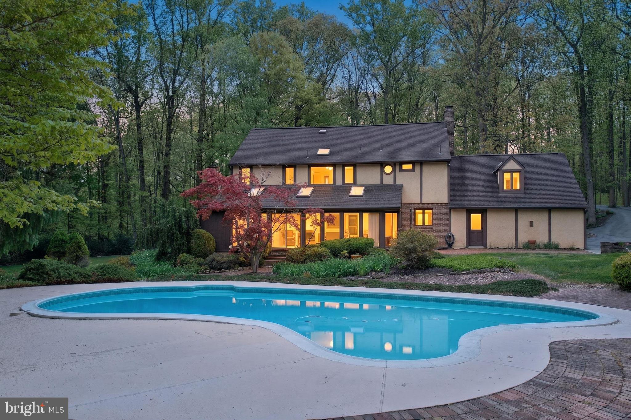 Set on a private 6-acre parcel bordering French Creek State Park, this 4-bedroom, 2.5-bath home offers 3,472 square feet of well-maintained living space in a peaceful, natural setting. Mature tree lines, walking paths, and established landscaping create a quiet backdrop for everyday living.

Inside, the home is thoughtfully laid out with a balance of formal and casual spaces. The living and dining rooms provide traditional areas for entertaining, while the kitchen opens to a bright breakfast area and flows into a spacious four-season room with vaulted ceilings, fireplace, and expansive windows overlooking the property.

Upstairs, the primary suite includes a sitting area, dressing space, and private bath. Three additional bedrooms and a full hall bath complete the second floor. The finished lower level offers flexible space for recreation, hobbies, or additional entertaining.

Outdoor living is a standout feature with an in-ground pool, pavilion, and patio areas designed for relaxation and gathering. The setting offers direct access to nature while still being conveniently located near the charm of St. Peters Village and its local shops, dining, and trails.

A unique opportunity to own a spacious home with privacy, acreage, and close proximity to one of the area’s most desirable outdoor destinations.