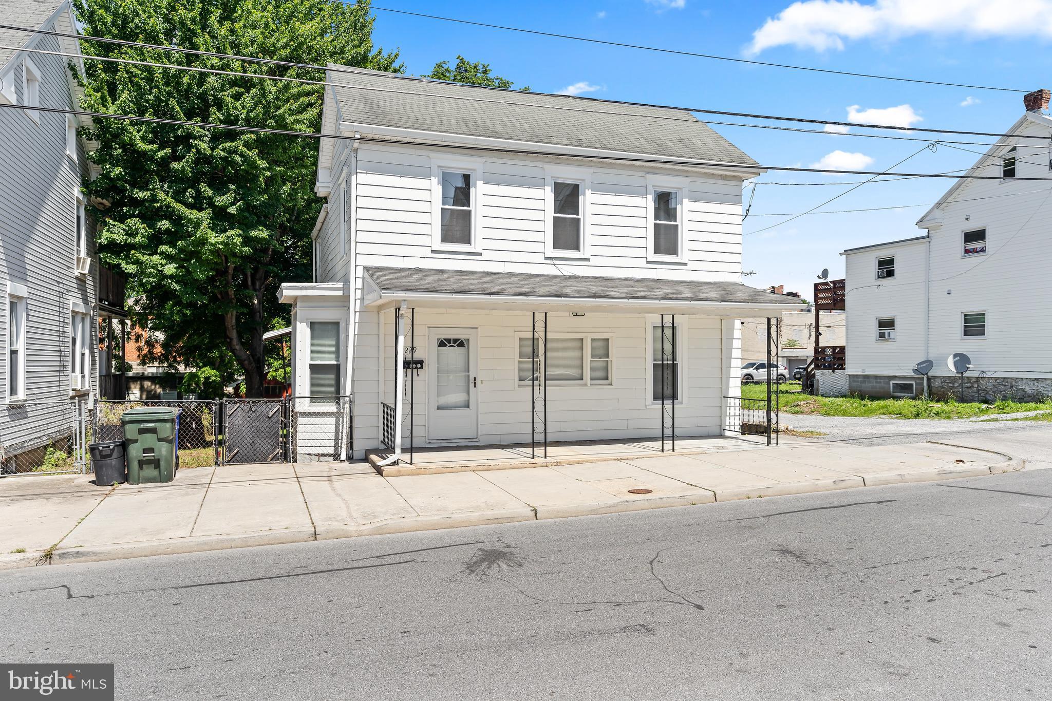 Wonderfully updated and truly move-in ready, this charming detached Colonial is centrally located downtown and just minutes from shopping, dining, schools, parks, and commuter routes. Featuring 3 bedrooms and 1.5 baths, this home offers the perfect blend of classic character and modern updates.

Recent improvements include a beautifully renovated kitchen, updated bathrooms, new flooring, fresh paint, modern fixtures, and more. The convenient main-level laundry adds everyday functionality, while the new HVAC system installed in 2023 provides year-round comfort and peace of mind.

Enjoy relaxing mornings on the covered front porch or entertain family and friends on the spacious covered rear porch overlooking the fully fenced backyard. Additional highlights include private off-street parking accessible from the alley and a one-car carport.

With its extensive updates, desirable outdoor spaces, and convenient location, this home is ready for its next owner to move right in and enjoy.