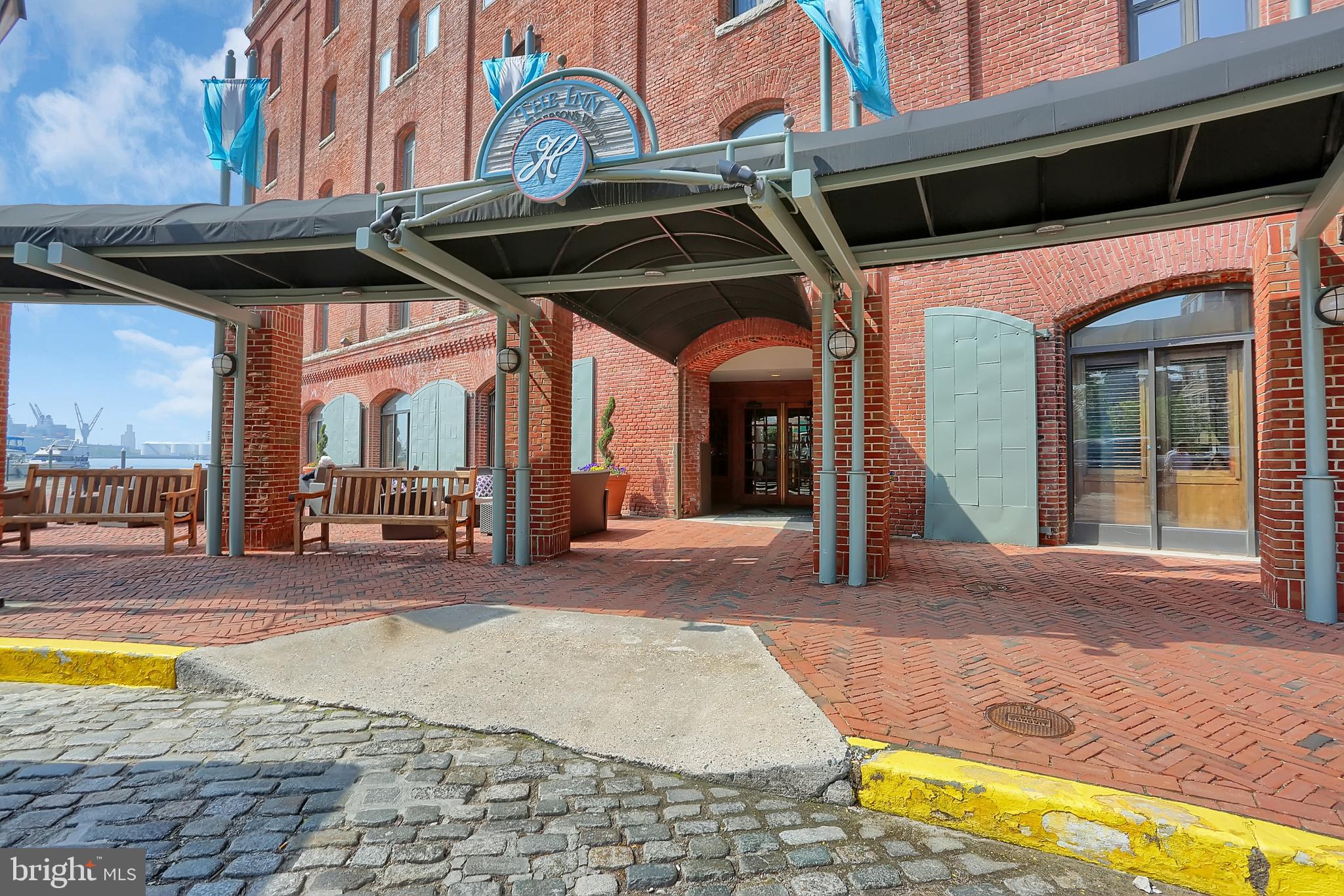 Just Reduced! Garage Assigned Parking Included!   Sassy Condo in the Historic Fell's Point District.  Enjoy Fell's Point fun,  but  when you're ready to unwind  go home to the waterfront Henderson's Wharf.  Residents have their own entrance and elevators.  You'll be happy to know that the 24 Security, concierge,  fitness room and garage parking are included in the rent.  There are no additional fees for services except your utility bill and internet. The building offers a great courtyard and boardwalk promenade for those times you just want to relax outdoors.   The unit is fresh and airy with a washer/dryer in the unit,  engineered wood floors, a renovated kitchen, walk-in closet, and large windows that overlook the courtyard. Fell's Point is jumping with bars, shops and festivals but this building is located on one of most quiet, picturesque streets in the area.    Please note the tenants must have a 650+  credit rating.