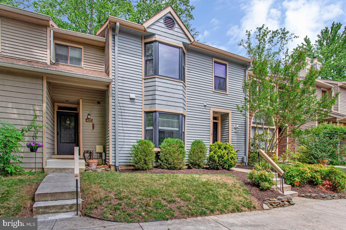Welcome home to this stylish contemporary townhome offering 3 bedrooms, 3.5 baths, and a thoughtfully designed floor plan perfect for today's lifestyle. The open main level is ideal for everyday living, featuring a spacious kitchen with stainless steel appliances, a center island, and a sunny bay window. Just beyond, the separate dining room overlooks the step-down family room, where a fireplace creates a warm and inviting focal point for gatherings with family and friends. The upper level is highlighted by a spacious primary suite with a soaring vaulted ceiling, a large walk-in closet, a private bath, and deck—the perfect place to enjoy your morning coffee or unwind at the end of the day. Two additional bedrooms and a shared full bath complete the upper level. The finished lower level provides even more living space with a comfortable family room that opens to the fenced backyard, along with a generous storage area to keep everything organized. Outside your door, enjoy an active community with tennis and pickleball courts, a dog park, picnic area, scenic walking trails, and an observation tower overlooking the beautiful Little Magothy River. Combining modern design, generous living spaces, and exceptional neighborhood amenities, this home offers the perfect balance of comfort, convenience, and outdoor enjoyment.