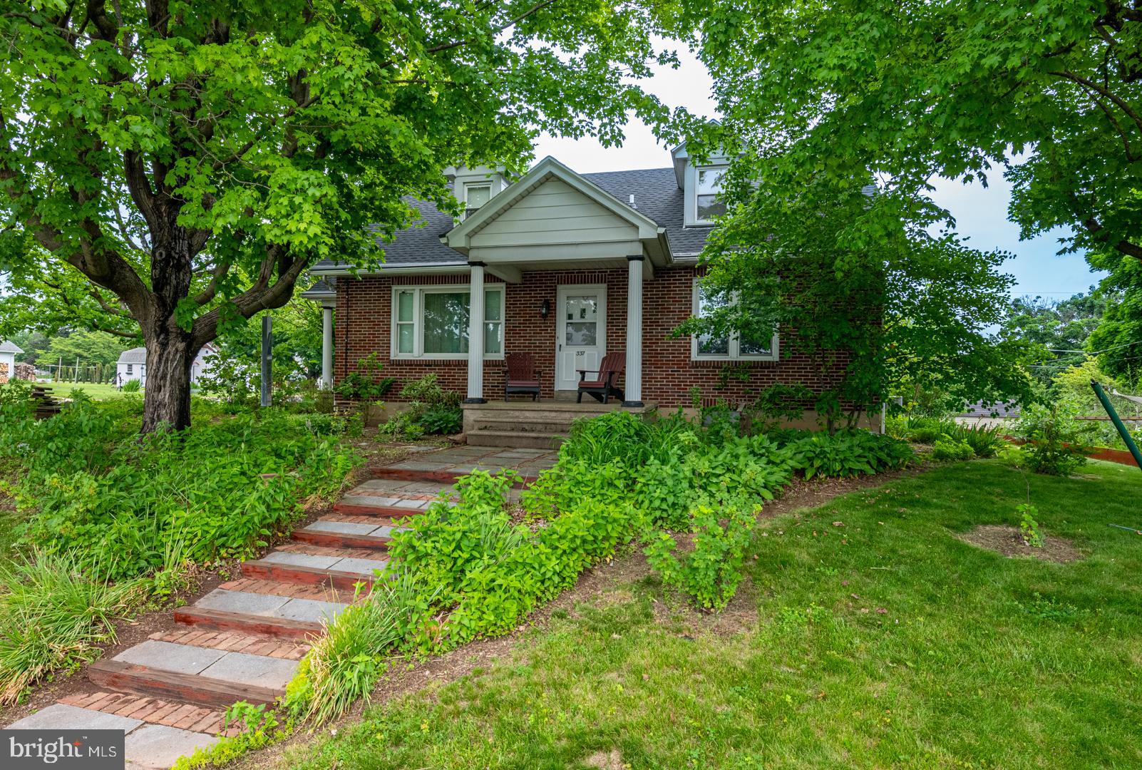 Charming brick Cape Cod offering 4 bedrooms, 2 full baths, and timeless curb appeal in the desirable Tulpehocken School District. Situated on a corner lot, this well-maintained home welcomes you with a beautiful brick and paver walkway leading to the inviting covered front porch.

Step inside to a spacious living room featuring hardwood flooring and an open flow into the beautifully updated eat-in kitchen. Designed with both style and functionality in mind, the kitchen boasts luxury vinyl plank flooring, a decorative tile backsplash, stainless steel appliances, and convenient access to a second covered porch—perfect for enjoying your morning coffee or relaxing evenings outdoors.

The main level offers two generously sized bedrooms with large closets and a full bath, providing flexibility for guests, home office space, or single-floor living. Upstairs, you'll discover the expansive primary bedroom featuring built-in drawers and abundant closet space. An adjoining bonus area offers endless possibilities as a home office, nursery, sitting room, or playroom. A second full bath with heated floor completes the upper level.

The lower level expands the home's living space with a large fourth bedroom and additional storage opportunities.

Outdoor living is equally impressive with a spacious patio area ideal for entertaining family and friends, summer barbecues, or simply enjoying the peaceful surroundings. Garden enthusiasts will appreciate the property's established food-producing plantings and the beauty and shade provided by five mature Norway Maple trees.

Additional highlights include a detached two-car garage, ample off-street parking, and a convenient location close to schools, recreation facilities, shopping, dining, and everyday amenities.

Whether you're looking for charm, functionality, or outdoor enjoyment, this delightful home has it all. Don't miss your opportunity to make it yours!