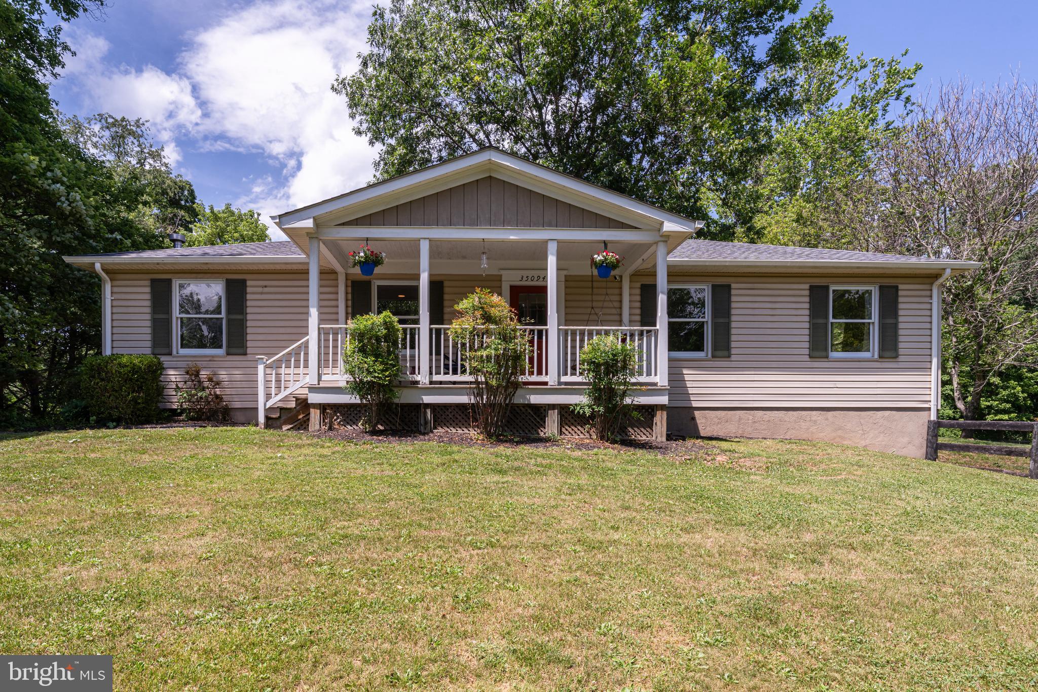 Welcome to 35094 Scotland Heights Road, a beautiful home nestled in the sought-after Scotland Heights community in the Town of Round Hill. Situated on a spacious 1.43 acre parcel, this property offers the perfect blend of small-town charm, privacy, and convenience. The main level offers a welcoming flow between the kitchen, dining, and living areas, creating an inviting atmosphere for everything from family celebrations to quiet evenings at home. The finished, walk-out basement provides extra living space including a large bedroom, plenty of storage, and a full bathroom. Step outside and enjoy the peaceful patio area and backyard with plenty of space for gardening, chickens, and outdoor entertaining. The property also includes a heated detached two-car garage with ample room for vehicles, tools, equipment, and workshop activities. Recent upgrades include: new roofs on all three structures replaced in 2024, an updated powder room, a new refrigerator and oven installed in 2023, refinished hardwood floors, and clearing around the stream in the rear yard. You do not want to miss this opportunity to live in the countryside of Western Loudoun just minutes from Round Hill, Purcellville, Franklin Park, major commuter routes, shopping, dining, and the area's renowned wineries and breweries!